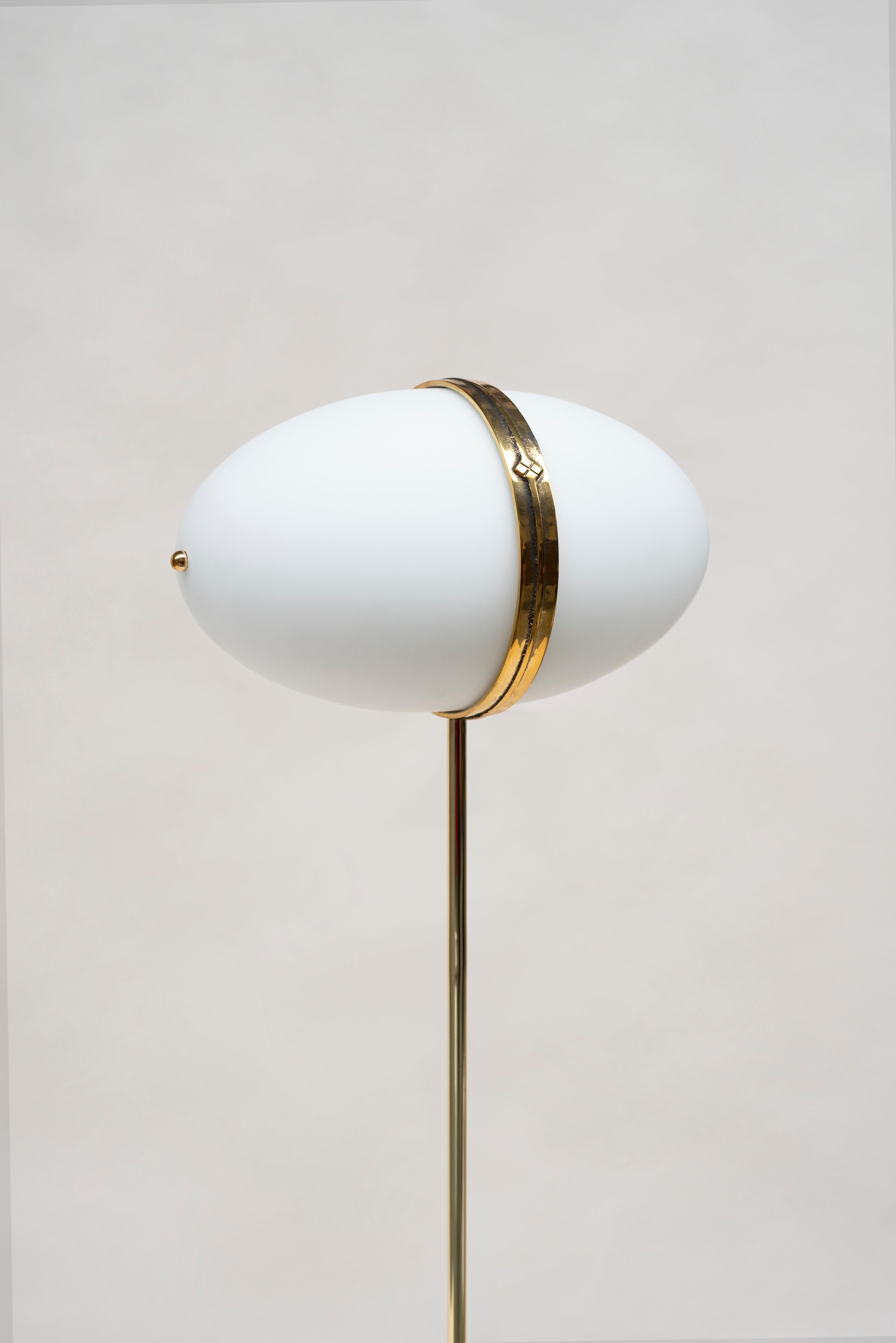 The 'Dolly' MW302 floor lamp was designed by Peter Ghyczy in 2018 and hand-made in the GHYCZY atelier in the South of the Netherlands. The Dolly lamp combines Peter's visual motifs that centre symmetry and organic forms. Yet, the floor lamp also