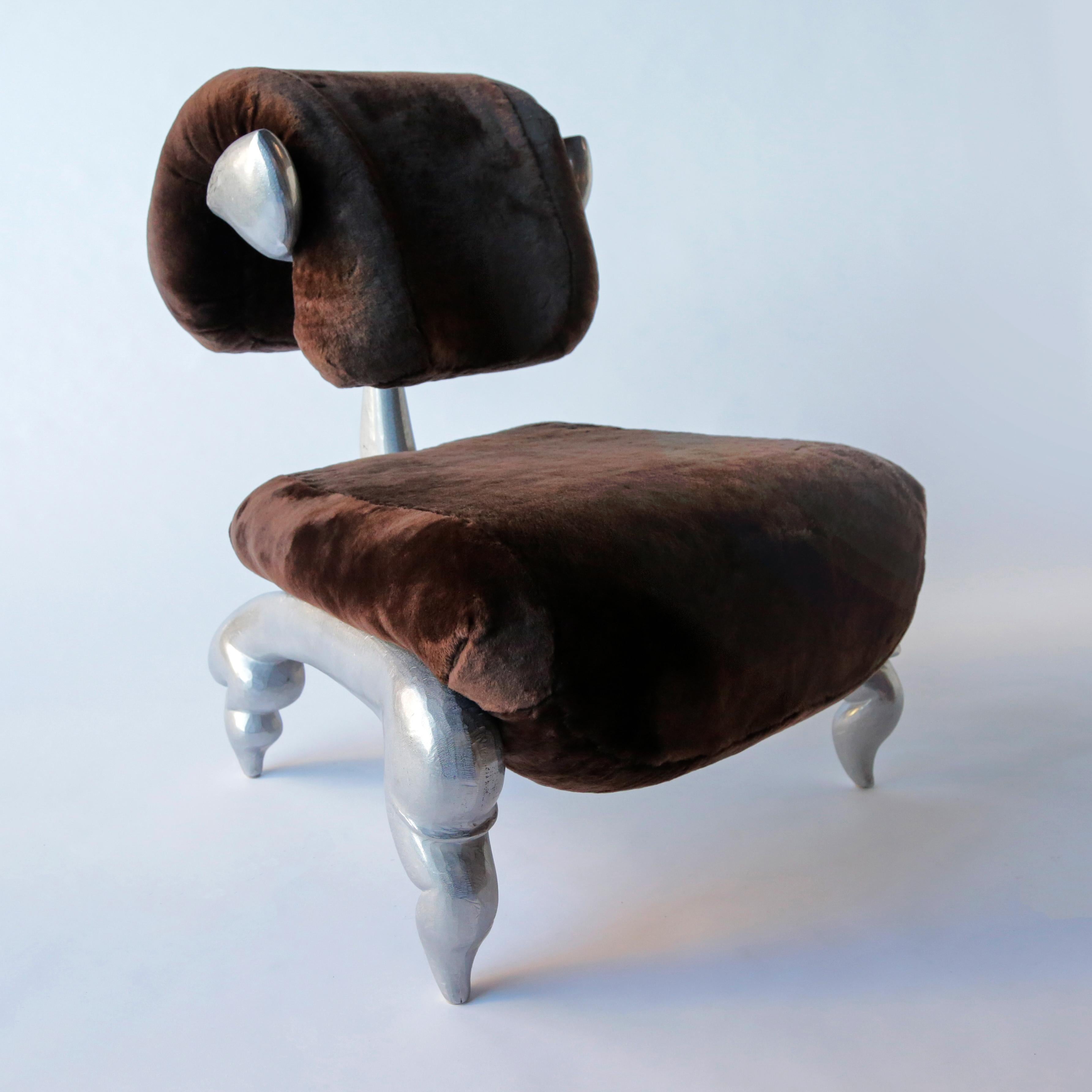 Dolly (Sheep) lounge chair, cast and hand worked burnished recycled aluminum, shearling, Jordan Mozer, Chicago, 2018 
Provenance: Collection of the artist. Signed.
Measurements; 31 