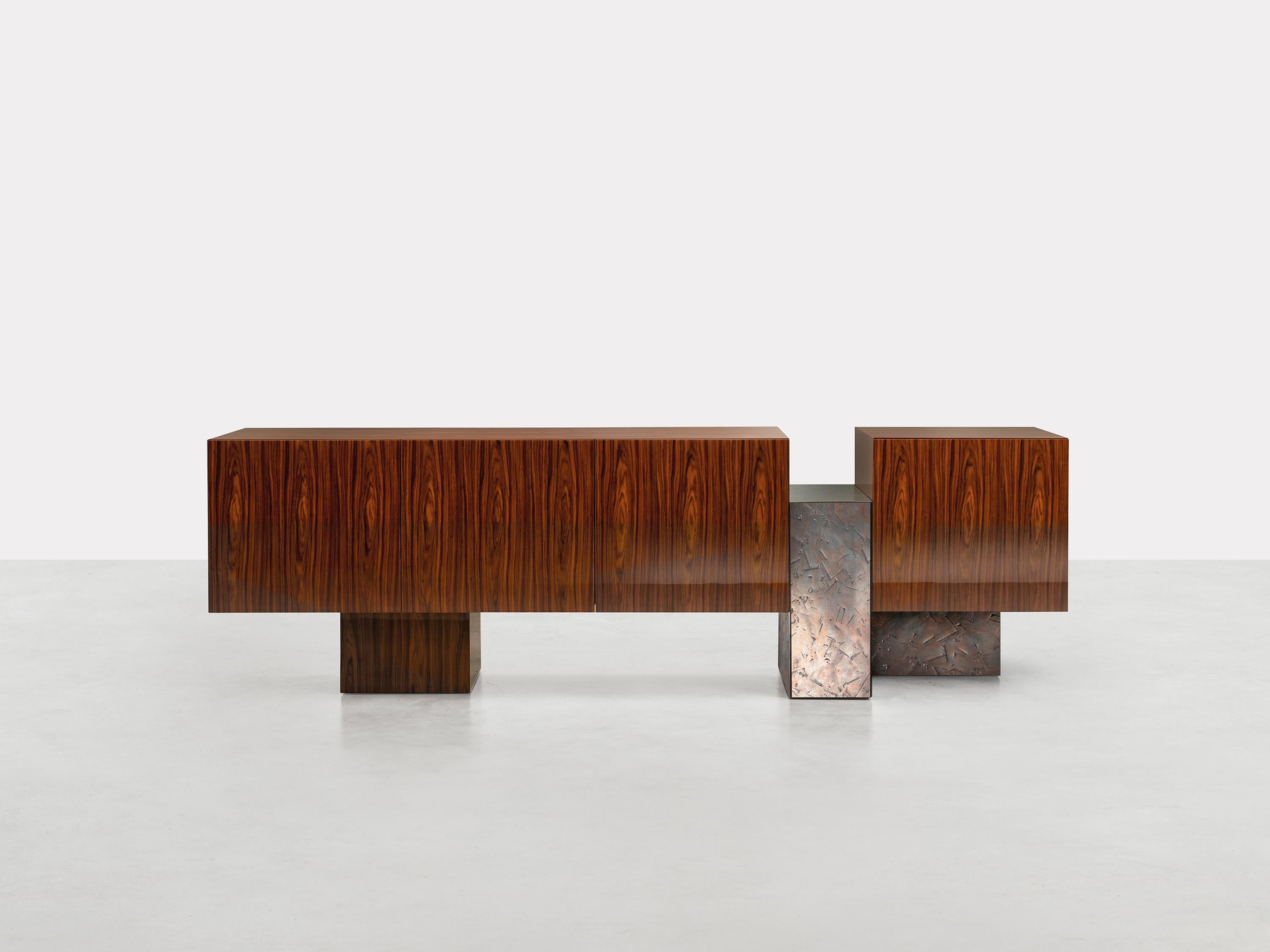 Dolmen Sideboard by Somaschini
Dimensions: W 234 x D 50 x H 71 cm
Materials: Plywood structure and doors with workmanship at 45 degrees. Doors with push-pull system opening. Internal compartments with three bronze glass shelves. S27 Black Ash wooden