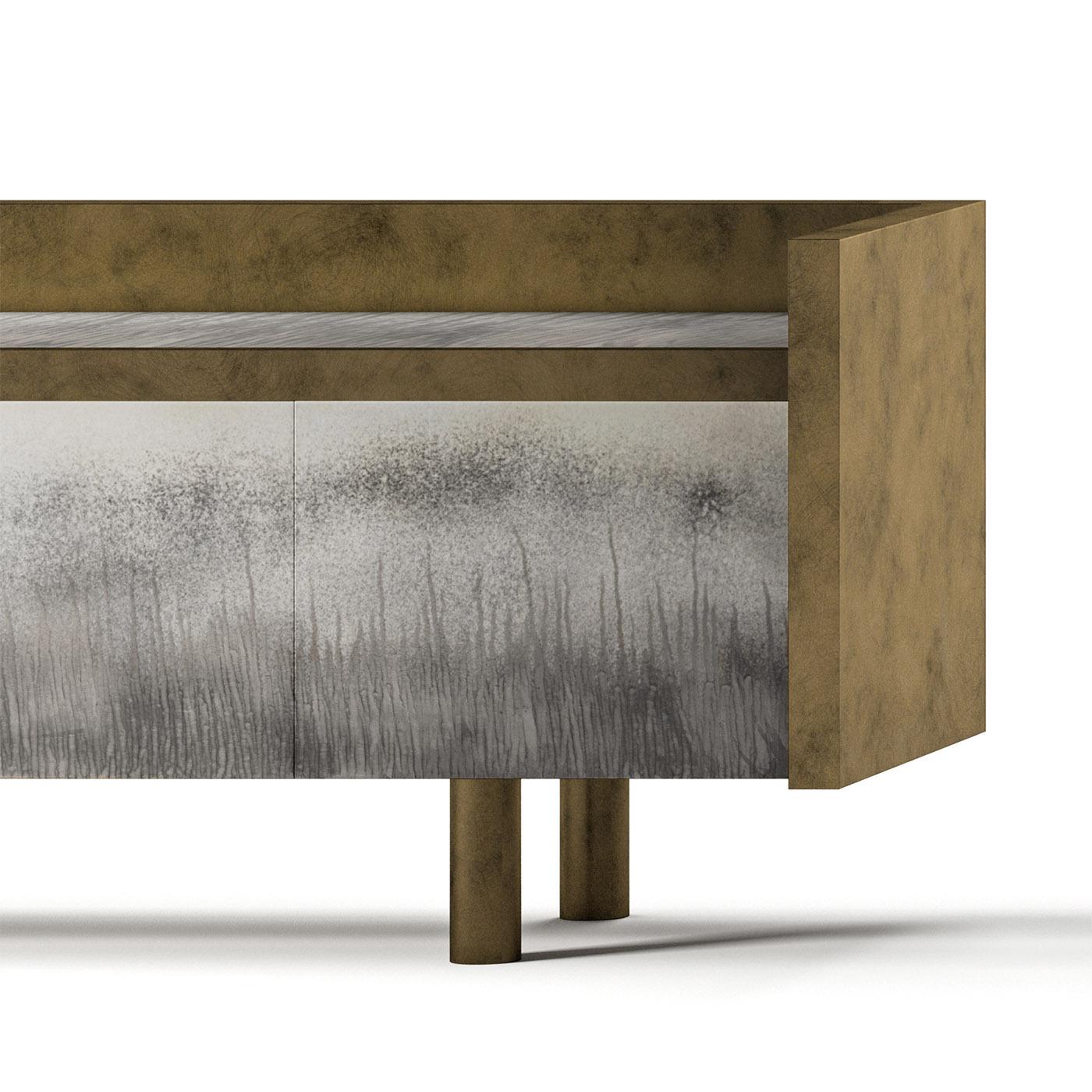 Designed by Leo De Carlo for the Boulder collection, this contemporary sideboard is characterized by a finishing that resembles 