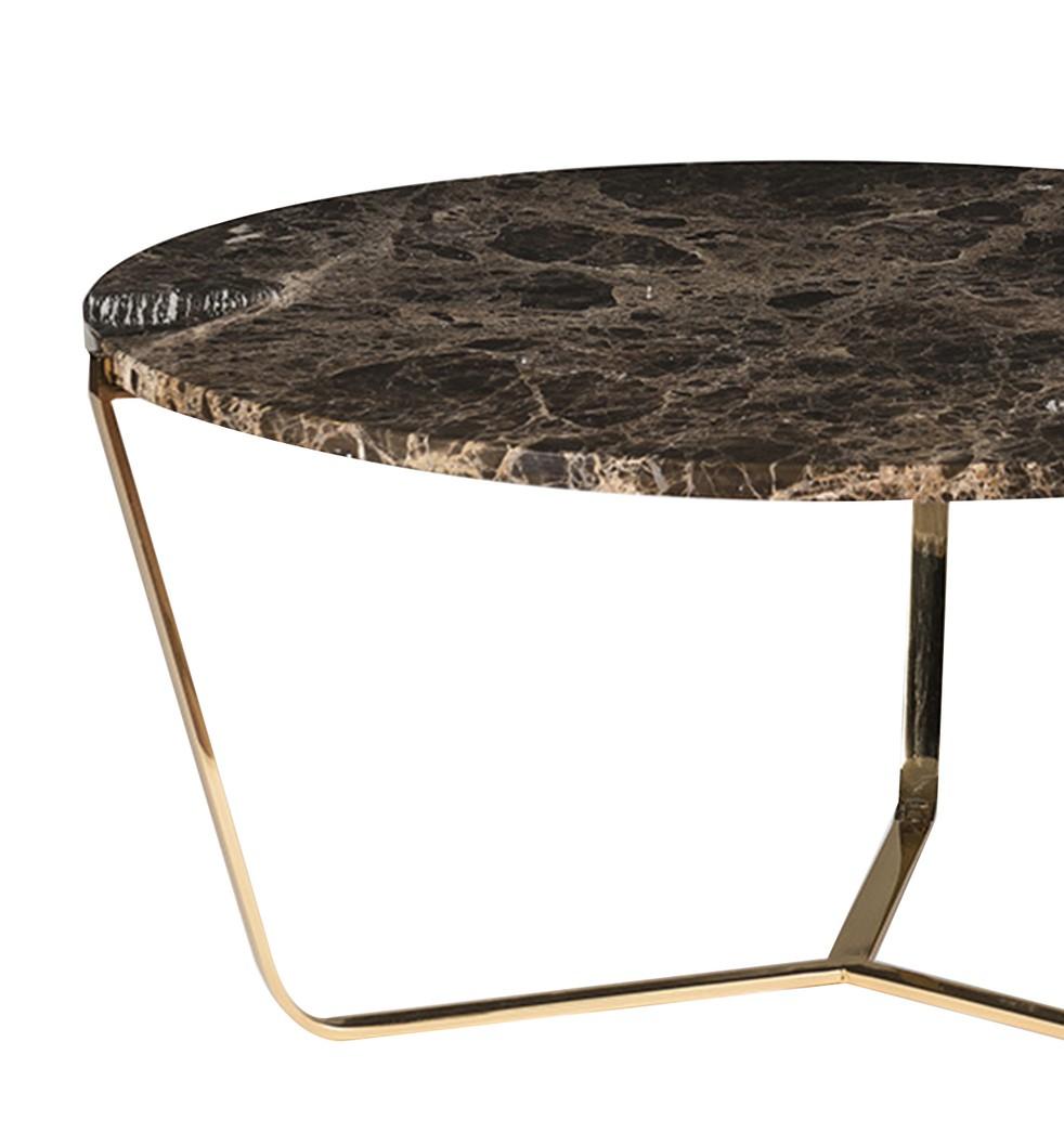 Elegant and timeless, this tall coffee table is part of the Dolomiti collection and boasts a stunning top in Emperador Dark marble, 2cm thick and with a radius edge. This unique piece is supported by a steel structure in which the three slightly
