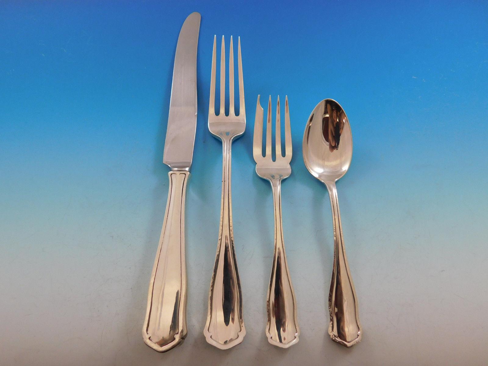 Exquisite dinner size Dolores by Shreve & Co. sterling silver flatware set - 77 pieces. This Arts & Crafts pattern was introduced in the year 1909 and features a unique raised border. This set includes:

12 dinner size knives, 9 7/8