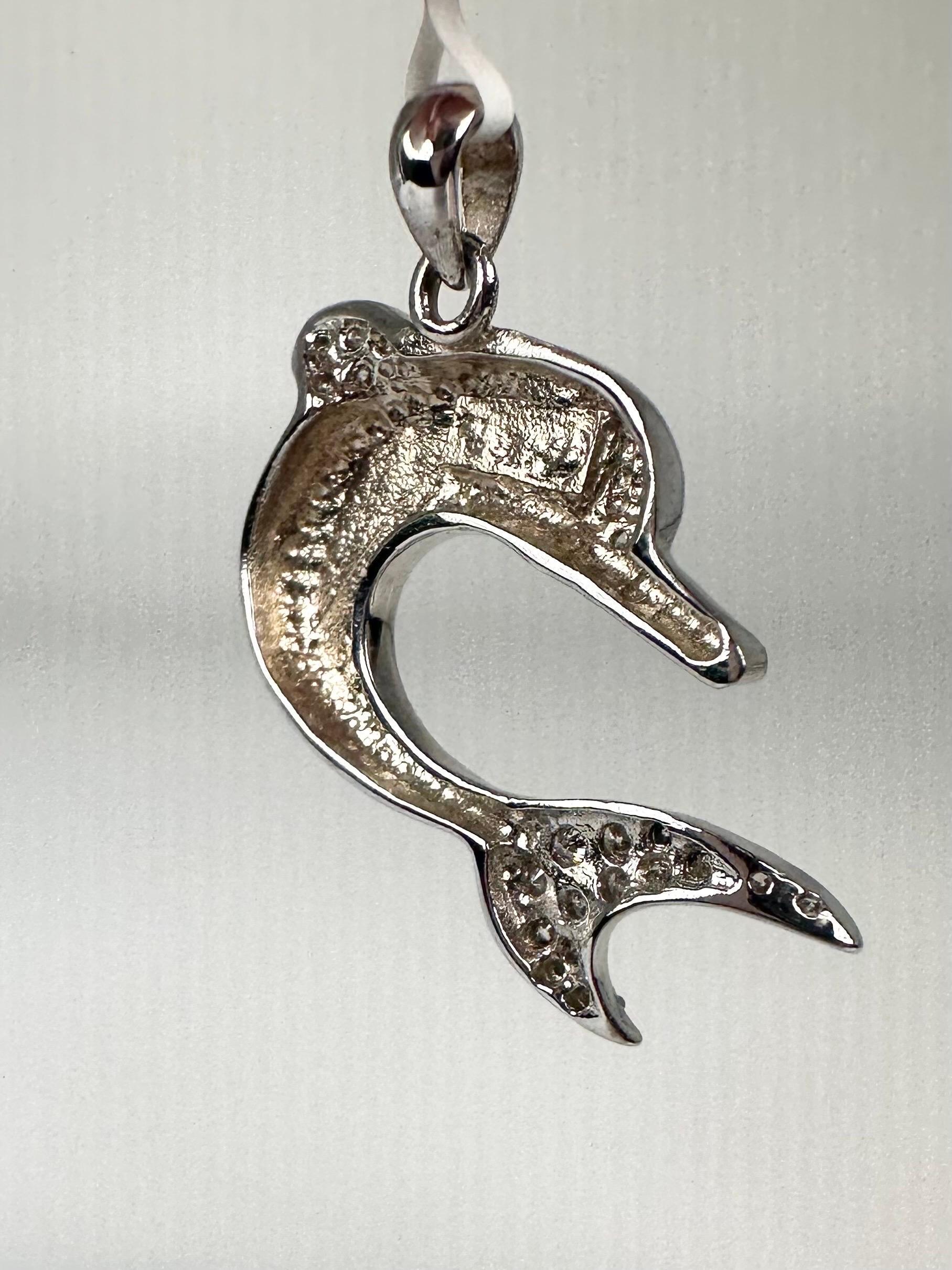 Stunning dolphin in 14Kt white gold with natural diamonds and 18