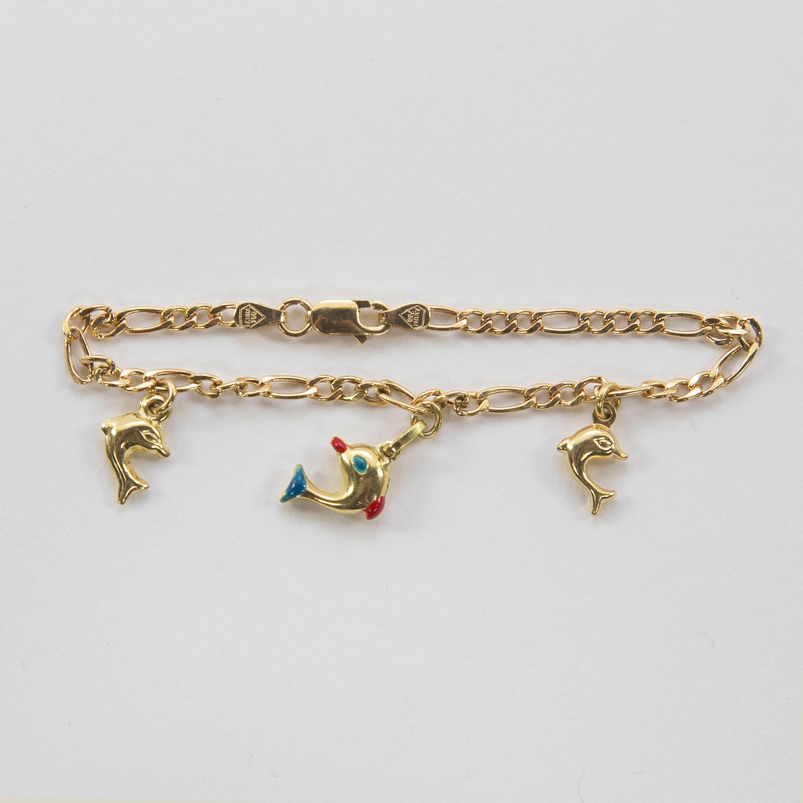 Delightful yellow Gold dolphin charm link bracelet with three 18k yellow gold mini Dolphins; marked: FARHA 750. Approx. length: 6.25”.  For that Special Someone…including you!  A Perfect gift for Baby or Grown-up! 

