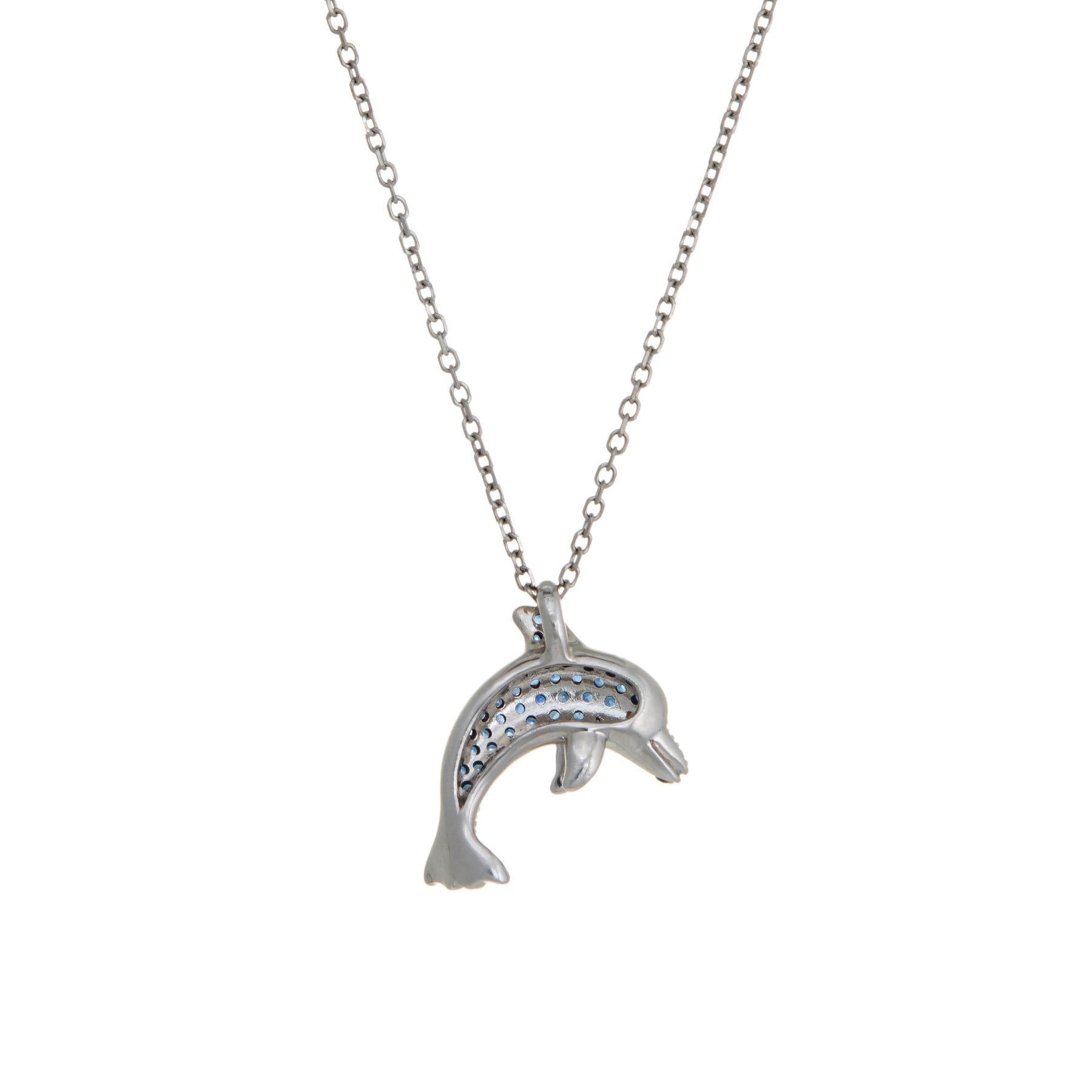 Elegant and finely detailed estate sapphire & diamond dolphin pendant & necklace, crafted in 14 karat white gold.  

Sapphires are pave set into the mount and total an estimated 0.40 carats. The diamonds total an estimated 0.10 carats (estimated at