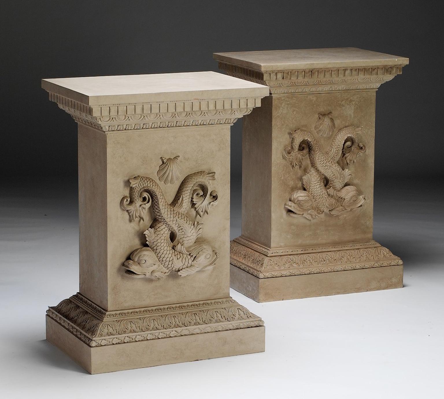 This handsome carved pedestal has a square, carved and dentil-moulded top. Finely carved with entwined dolphins below scallop shells. The base of complex carved leaf compound moulded plinths.

This item is made to order. 

Note that the price is for