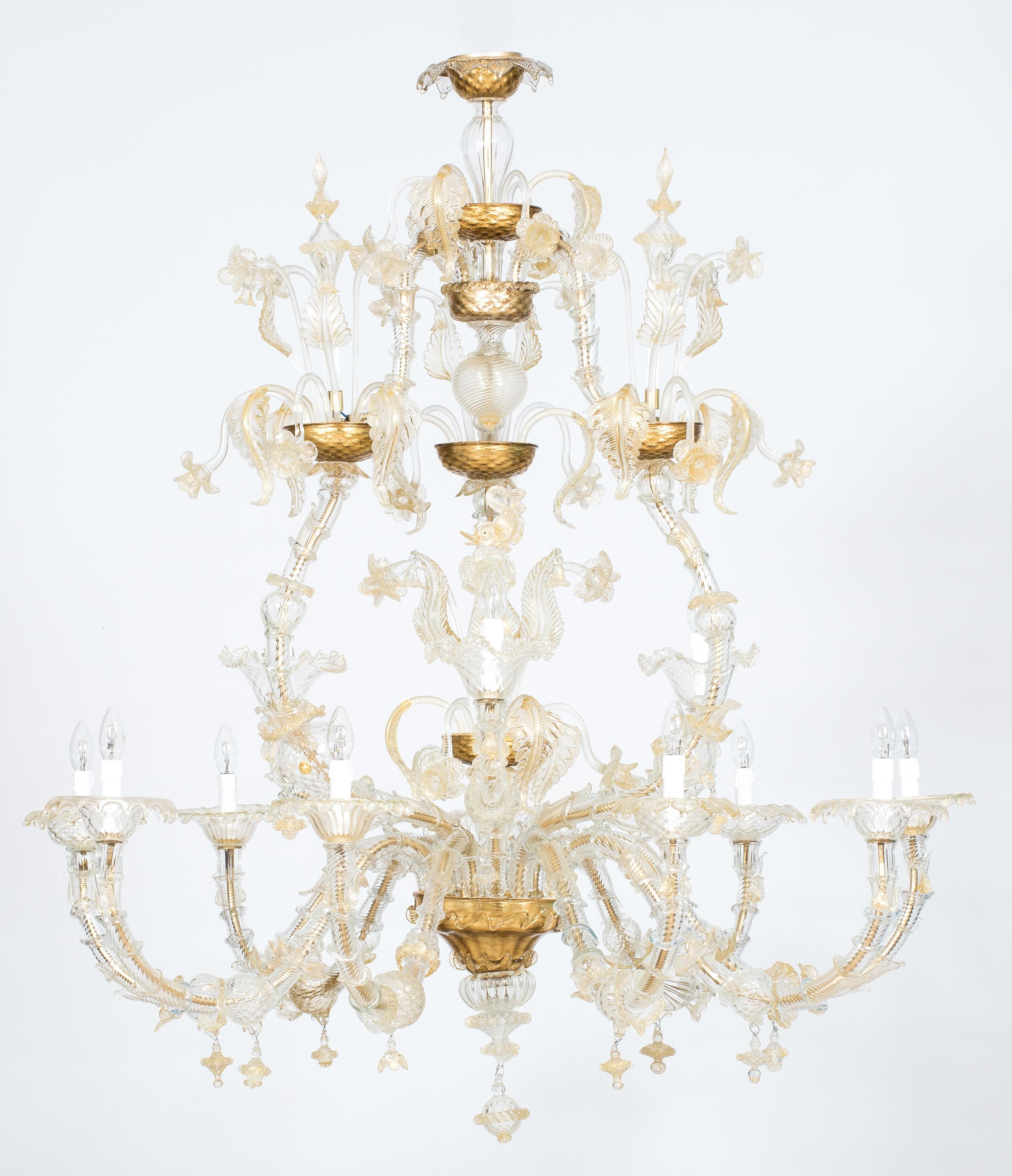 Dolphin Rezzonico Chandelier in Murano Gold Glass  1980s Italy. Rezzonico Murano glass chandelier with 12 lights and gold finishes, Venice.
This superb Murano glass chandelier is an outstanding example of the best Italian art: the richness and