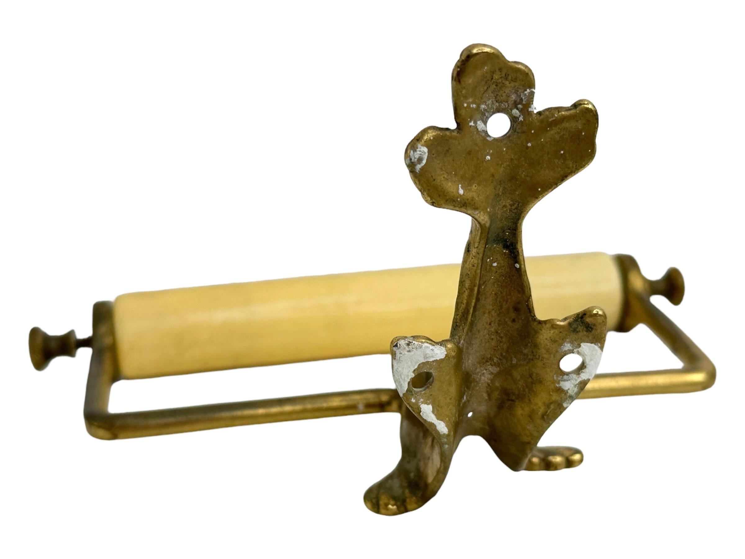 A gorgeous wood and metal Toilet paper roll holder. Made of Brass, with wood. No restoration has been carried out on this charming little wall holder, which remains in very stabile and functioning condition, wear is consistent with its age and use.