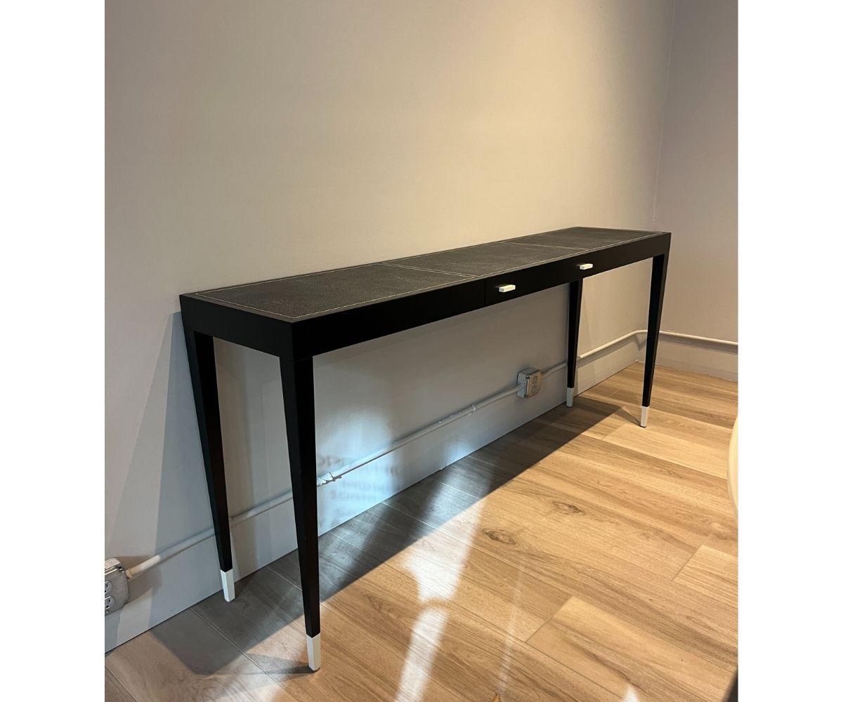 Designer: Kaki Kroener

Rigorous geometry and a light silhouette create the sophisticated design of this superb console. The timeless quality of this piece makes it an ideal addition to both a classic and a modern interior. Its structure is in