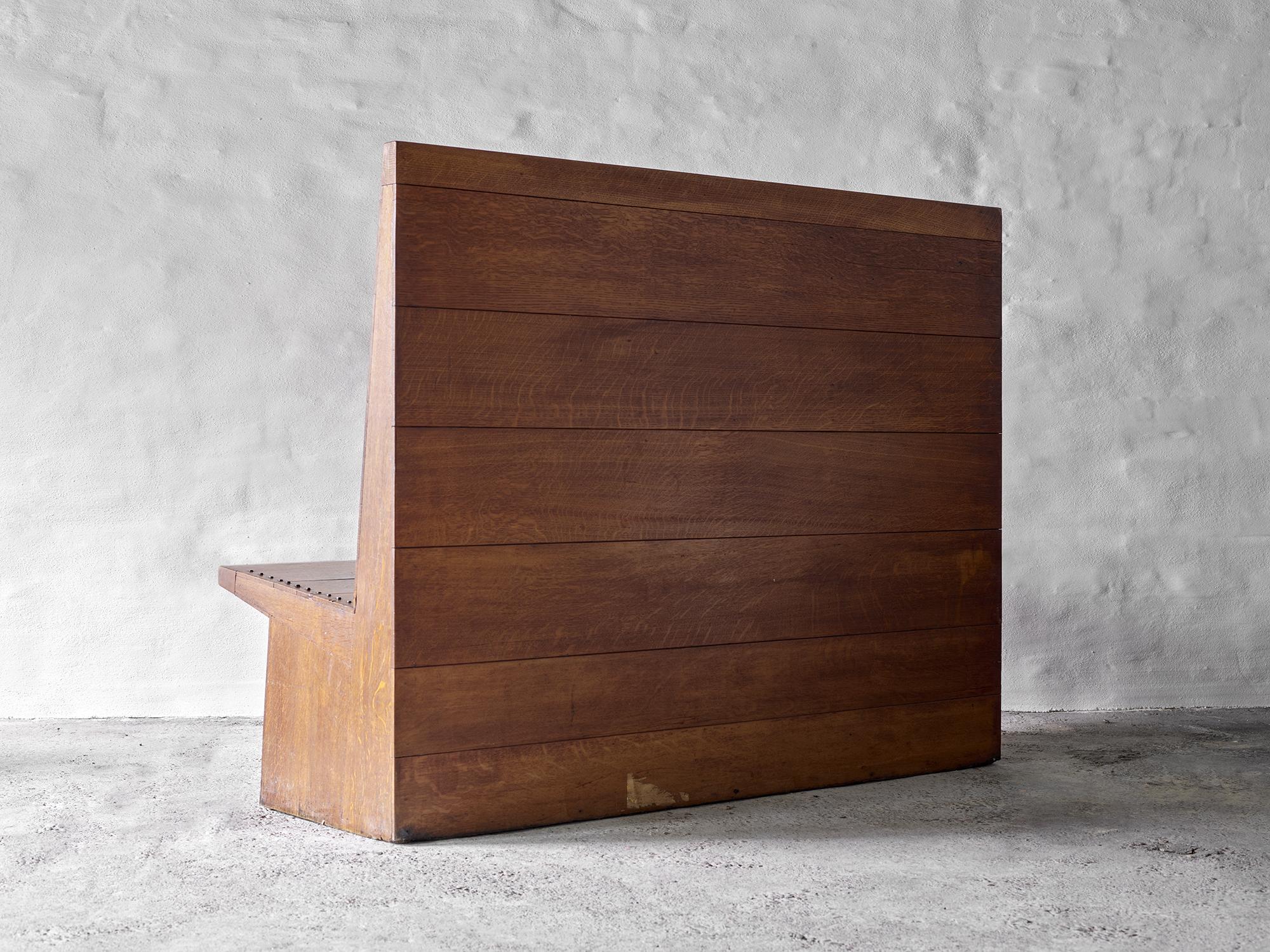 Unique High-Back Oak Bench by Dom Hans van der Laan
Commissioned for the Willibrordkerk (St. Willibrord’s Church), Almelo
The Netherlands, c. 1960s

This exceptional high-back bench, crafted from oak, is a rare example of furniture by Dom Hans van