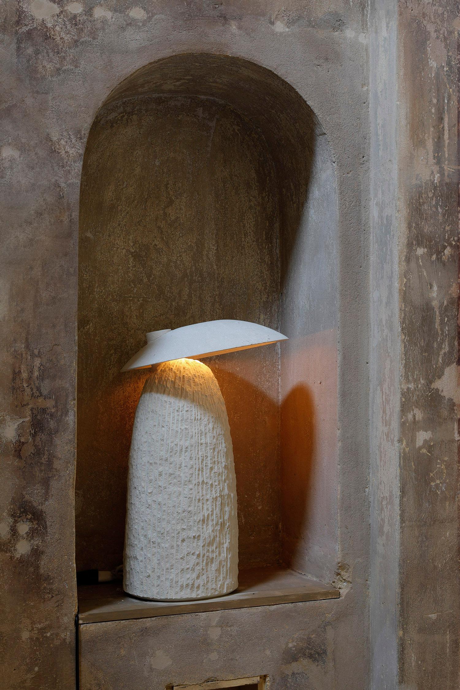 Doma table lamp by Frederic Saulou
Handmade
Materials: Limestone, led.
Dimensions: D 35 x W 35 x H 65 cm

Frederic Saulou's sculpted design artworks introduce a series of works coming from researches and partnerships between local ateliers and