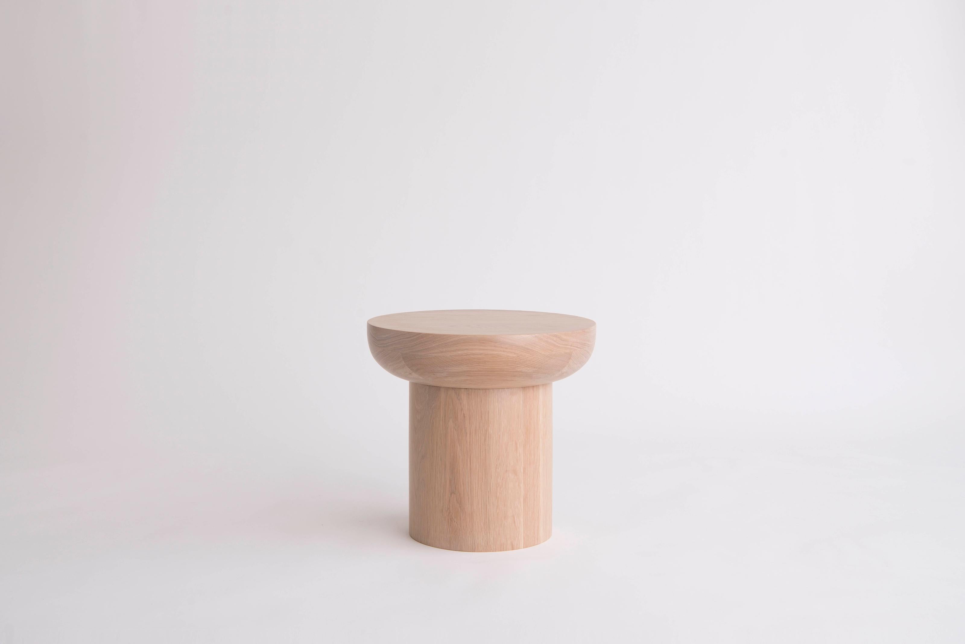 Dombak Medium Side Table by Phase Design
Dimensions: Ø 40,6 x H 38,1 cm. 
Materials: White oak.

Turned solid wood construction available in walnut, white oak, or ebonized oak. Available in three different sizes. Prices may vary. Please contact