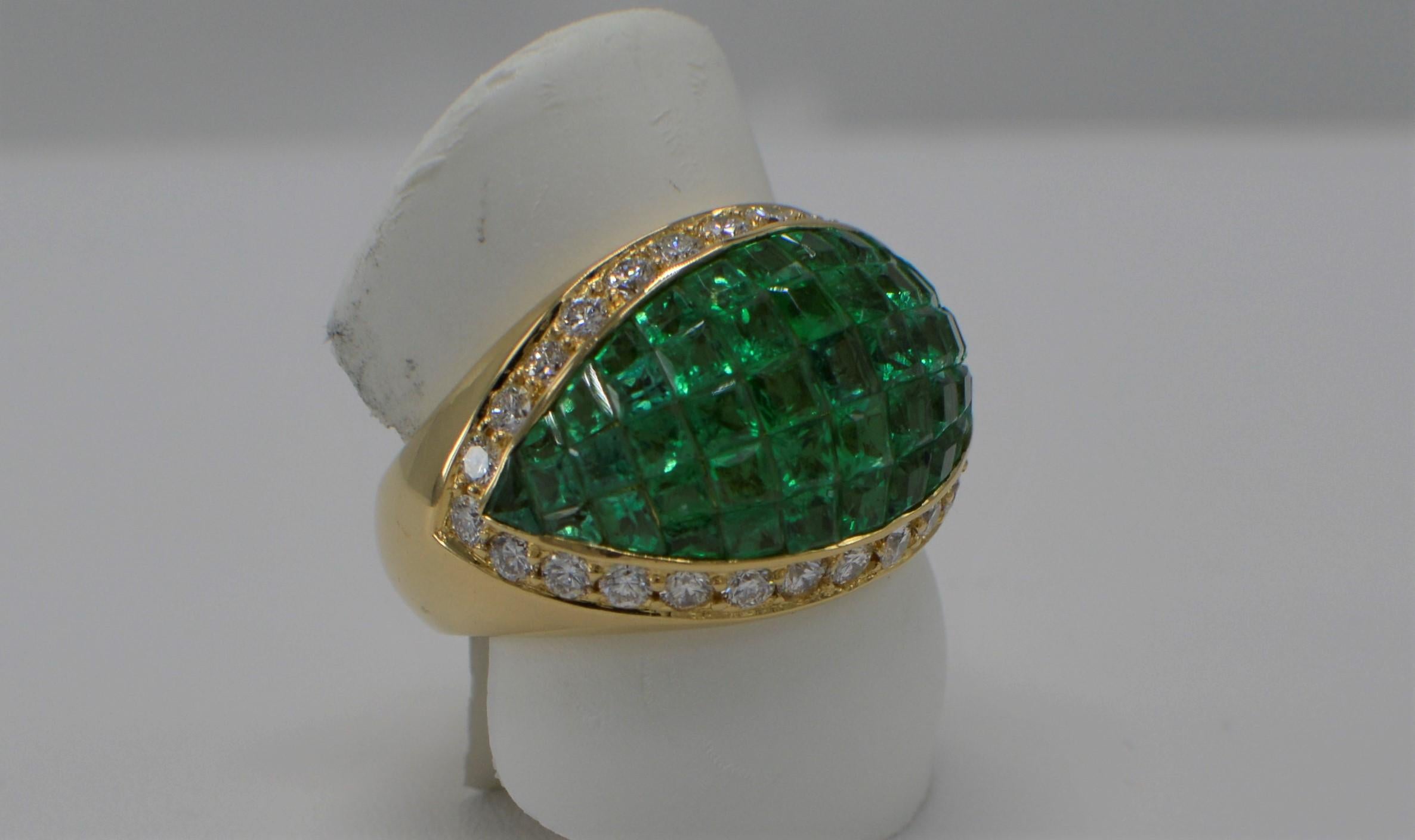 Impressive Emerald Dome Ring With Diamonds in invisible settings
Total Emeralds 6.0 carat - very nice green AAA
Total Diamonds 1.0 carat GH-VS
18k Yellow Gold  12.2 grams.
Finger size 6
All stones are natural - none Treated 

