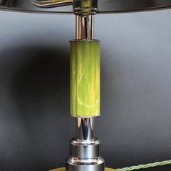 Art Deco domed table lamp with reeded, green bakelite stem over a stepped metal
