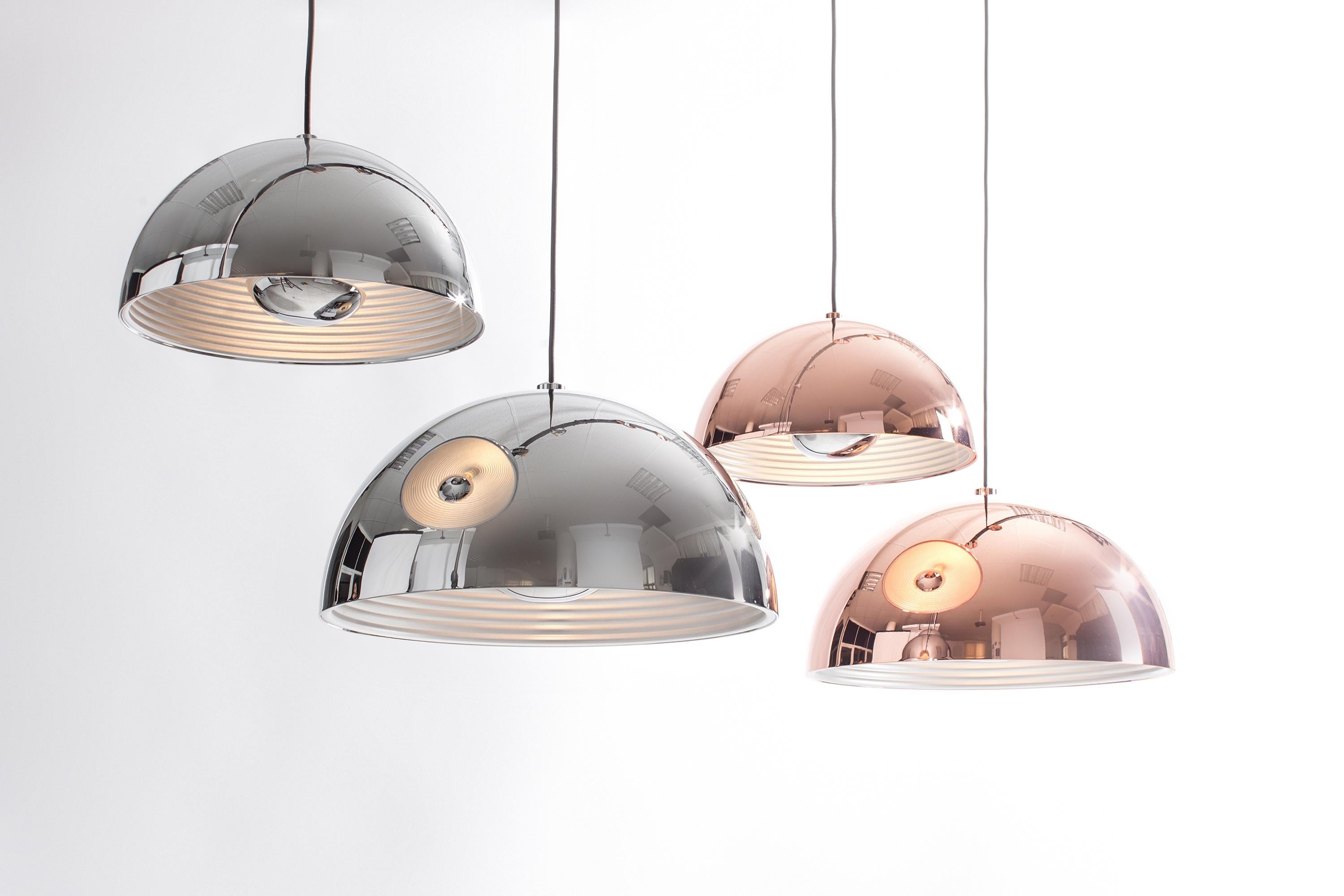DOME Pendant fuses simplistic ideologies with precision craftsmanship. Balanced with a clean classic silhouette, the DOME Pendant features a dramatic oversized lampshade in a very no nonsense approach. This design is spectacularly coated with a