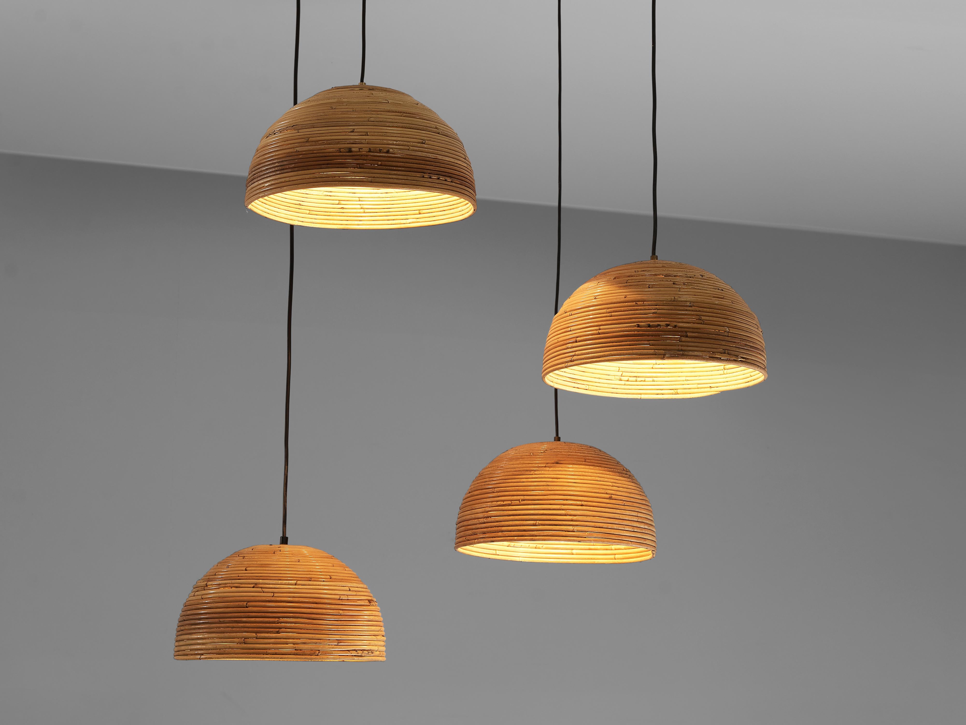 Dome pendants, bamboo bentwood, brass, Europe, 1960s

These pendants are made of bentwood bamboo which is layered horizontally and forms a dome shape light. The warm color of the natural material presents a soft lighting indoors as well as in