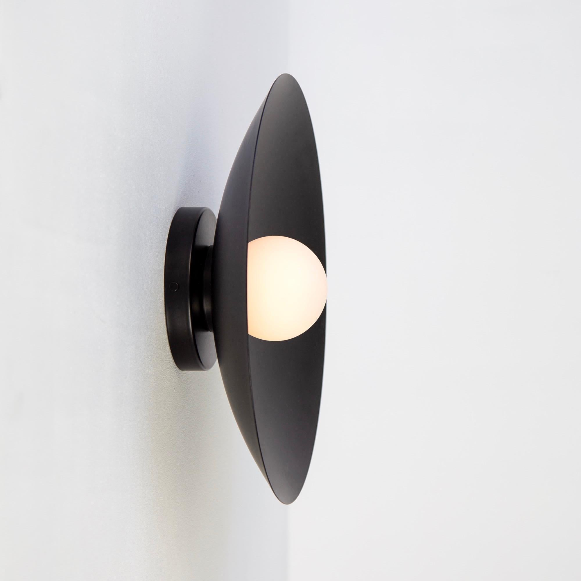 This listing is for 1x Dome Sconce in Black designed and manufactured by Research.Lighting.

Materials: Steel, Brass & Glass
Finish: Powder Coated Steel in black
Electronics: 1x G9 Socket, 4.5 Watt LED Bulb (included), 450 Lumens
UL Listed. Made in