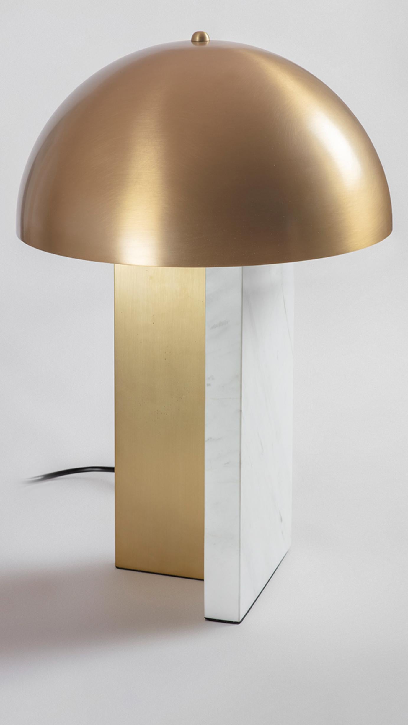 Dome table lamp by Square in Circle, 2022
Dimensions: H 43 x D 30 cm
Materials: Brushed brass, white marble

A minimalist table lamp with a bold silhouette brushed brass dome and a unique block white marble base. The base design features two