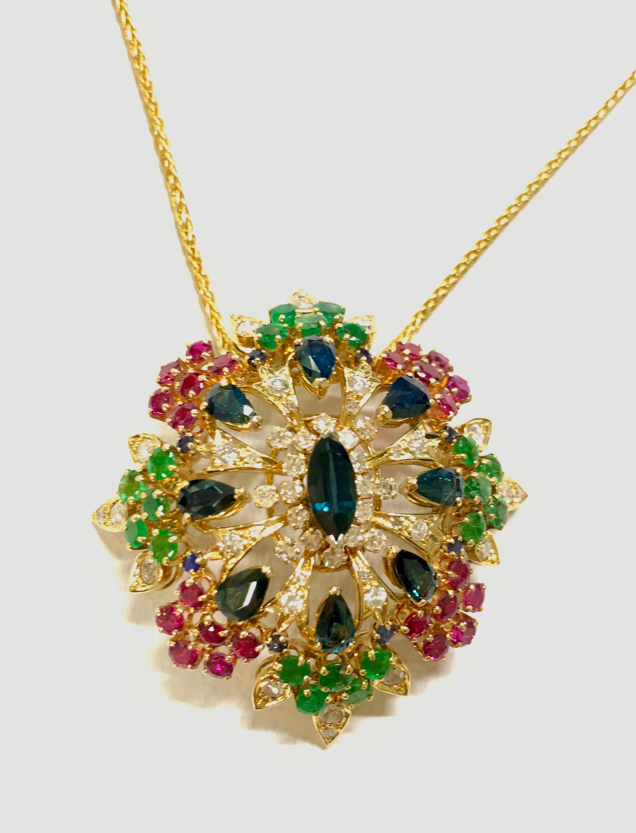 Stunning Domed Sapphire Diamond Emerald and Ruby Necklace Pendant 

Stones: Blue Sapphire 
Stone Shape: Pear and Marquise Cut  
Stone Weight: 10 Carat 
Stones: Ruby
Stone Shape: Round Cut  
Stone Weight: 2.50 Carat 
Stones: Emerald
Stone Shape: