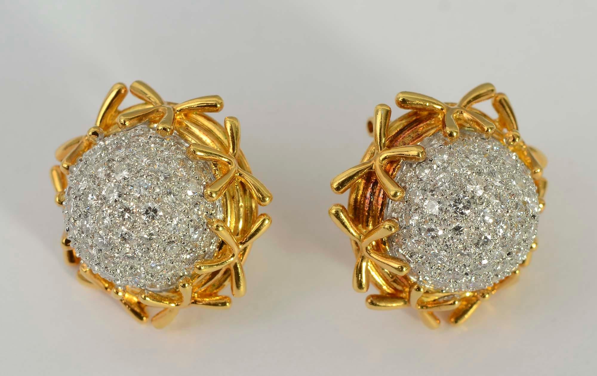 Elegant dome shaped diamond earrings nested in gold banding and gold criss crosses.
The earrings have 128 diamonds with a total weight of approximately 5 carats. The stones are VS quality; H color. The earrings are signed KS. 
Backs are posts and