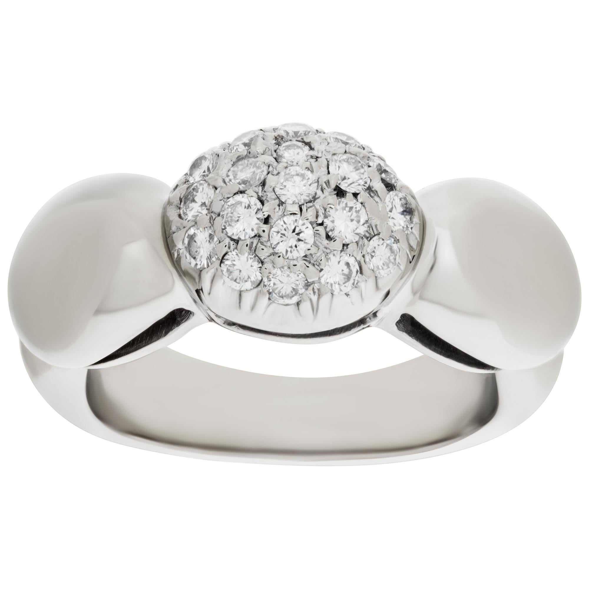 Darling domed diamond ring in 18k white gold with approximately 0.38 carat in round pave diamonds. Size 3.This Diamond ring is currently size 3 and some items can be sized up or down, please ask! It weighs 4.5 pennyweights and is 18k White Gold.
