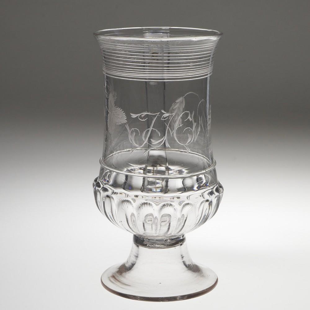 Heading : Gadrooned and engraved Georgian glass tankard
Period : George III - c1780 and perhaps a little earlier
Origin : England
Colour : Clear
Bowl : Baluster shape with trailed thread rim, engraved with hops leave, hop flower and barley,