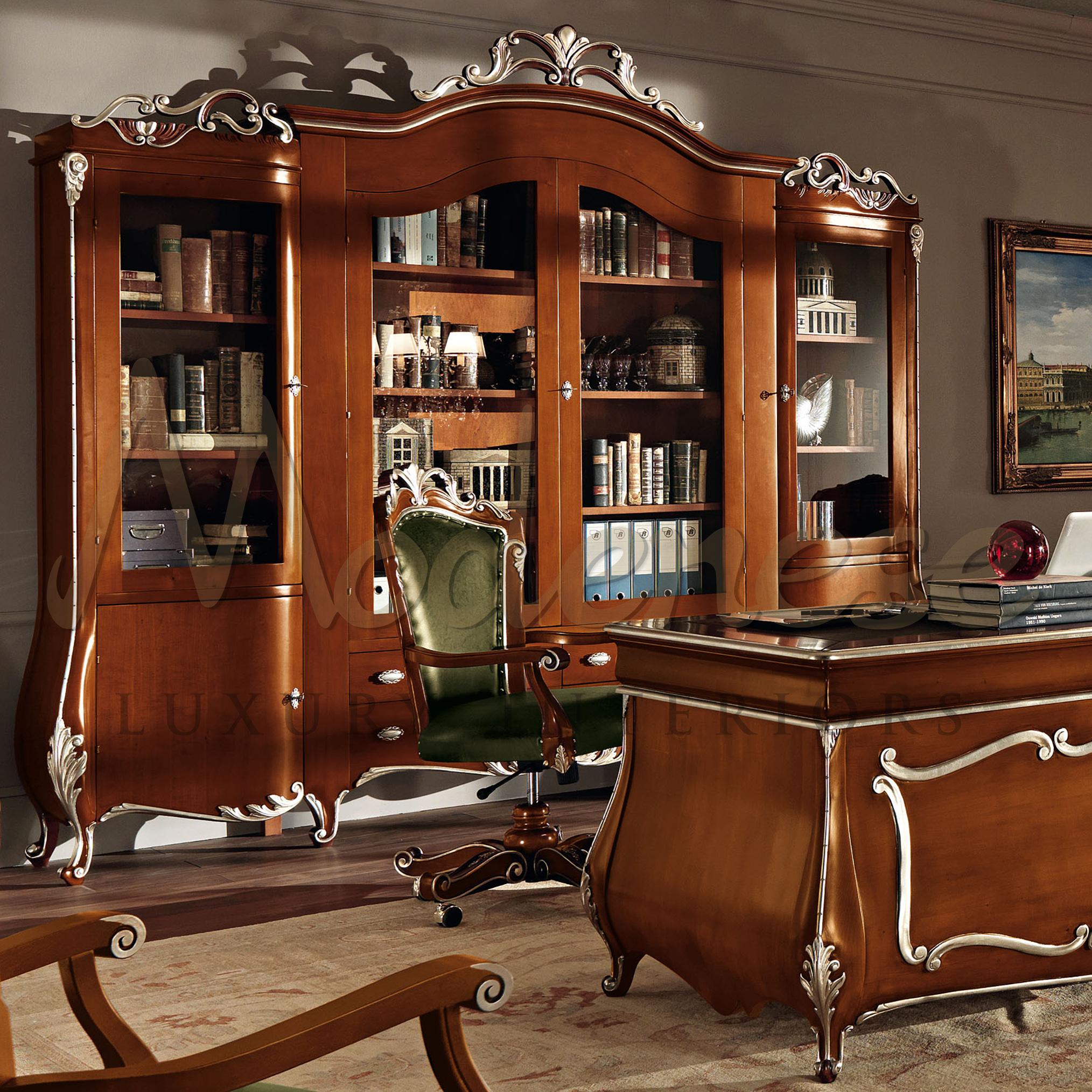 Modenese Gastone Interiors can be the perfect partner for your exclusive presidential office interior design project. This high-end four door vitrine bookcase in solid wood, with natural finish and silver leaf hand decorated details, defintely has a