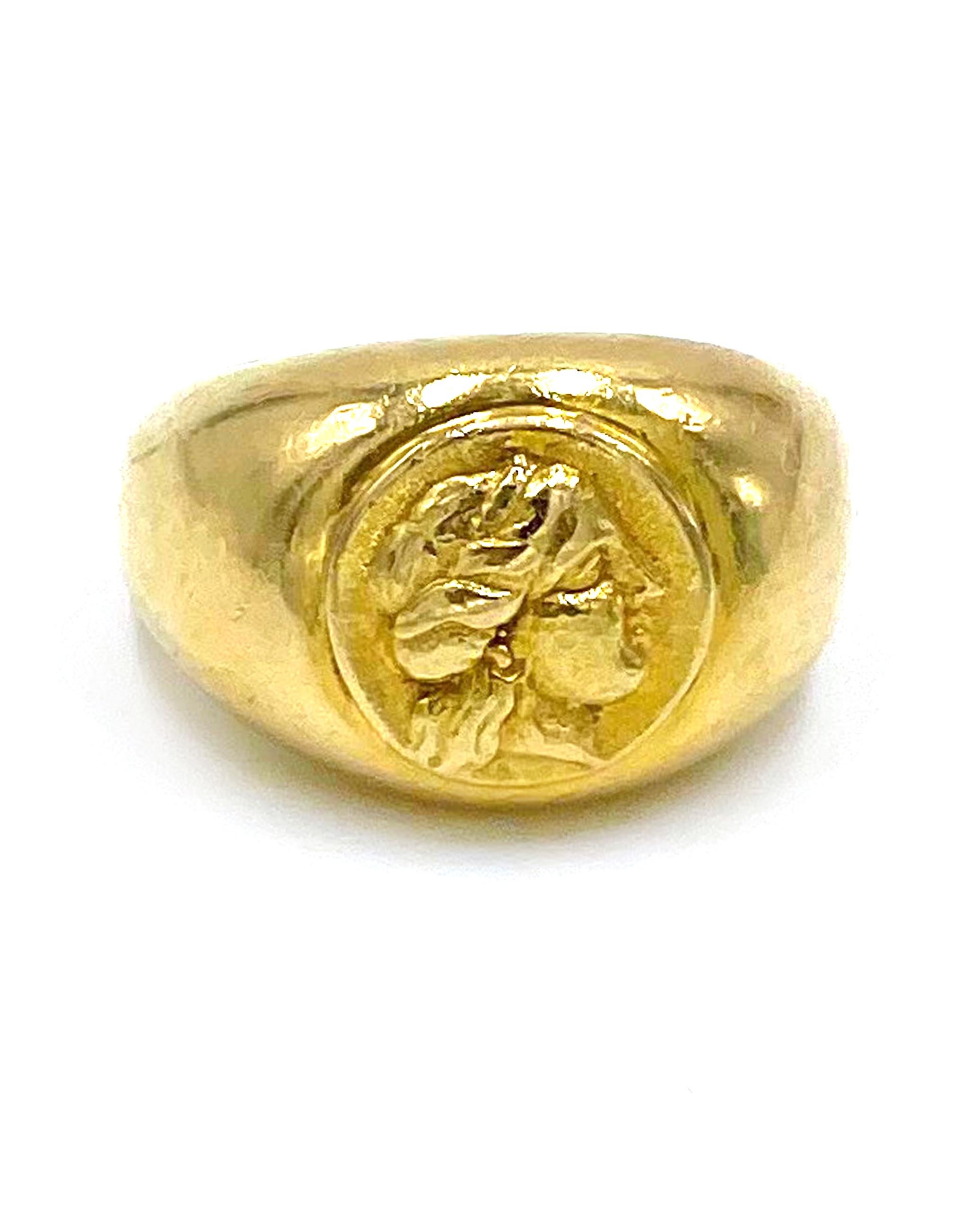 Pre owned vintage estate 18K yellow gold signet style domed ring centered with raised profile. 

* Finger Size: 8
* Weight: 19.0 grams
* Pre-owned: scratched evenly throughout
* Can be polished upon request