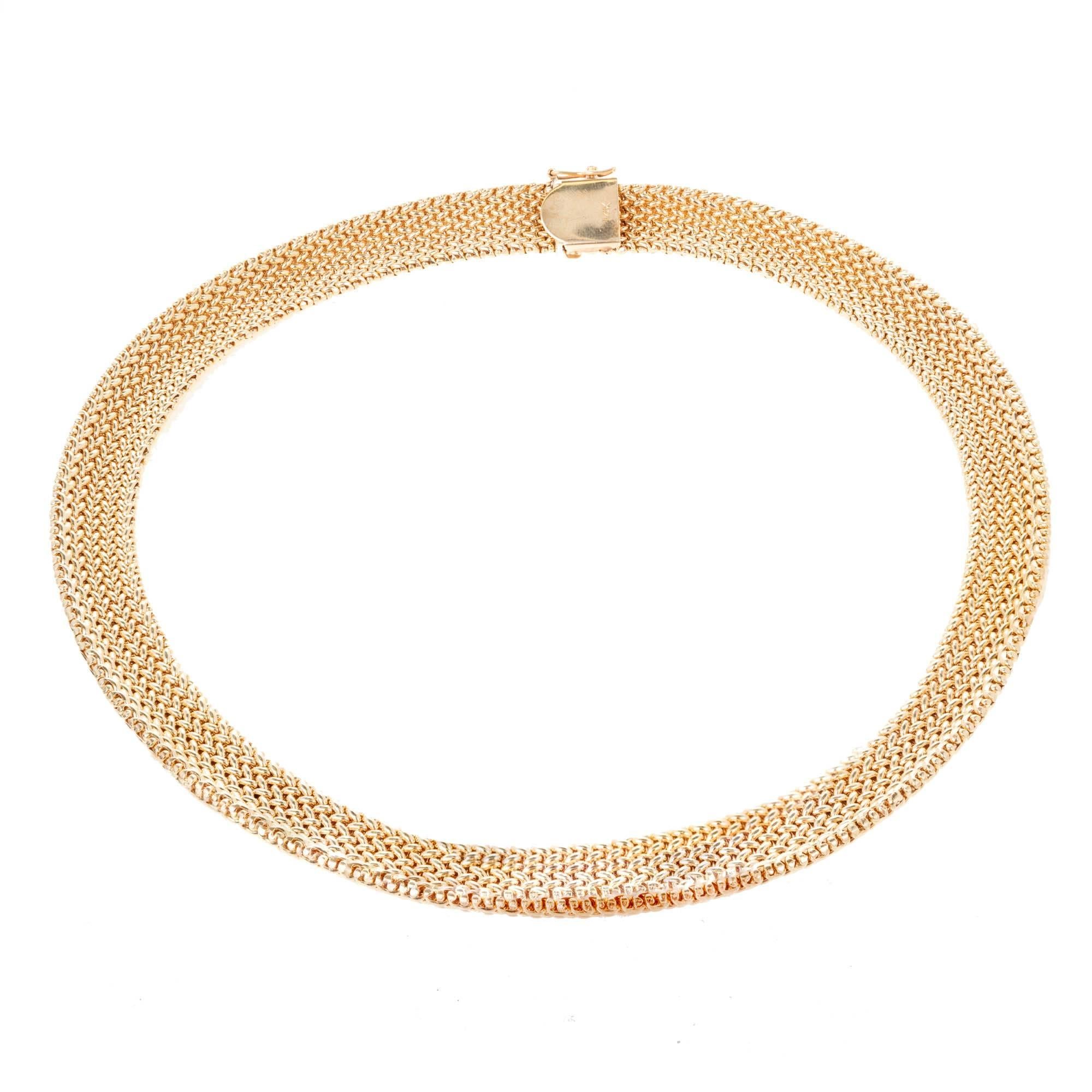 Domed mesh 16 inch 14k yellow gold 12mm wide necklace with built in catch and side lock safety. 16 inches in length. 

14k yellow gold
Stamped: 14k
Hallmark: PAT 4697315
Total length: 16 inches
Width: 12mm
Thickness/Depth: 3.12
68.5 Grams

