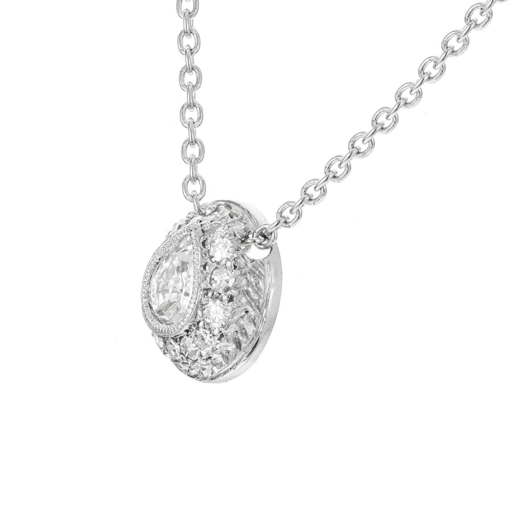 Platinum domed pendant slide necklace. Pear shaped center diamonds in a Platinum domed setting with 15 round pave set diamonds. Engraving and beaded. 16 inches in length. 

1 pear shape diamonds approx. total weight .43cts, H, SI1
15 round diamonds