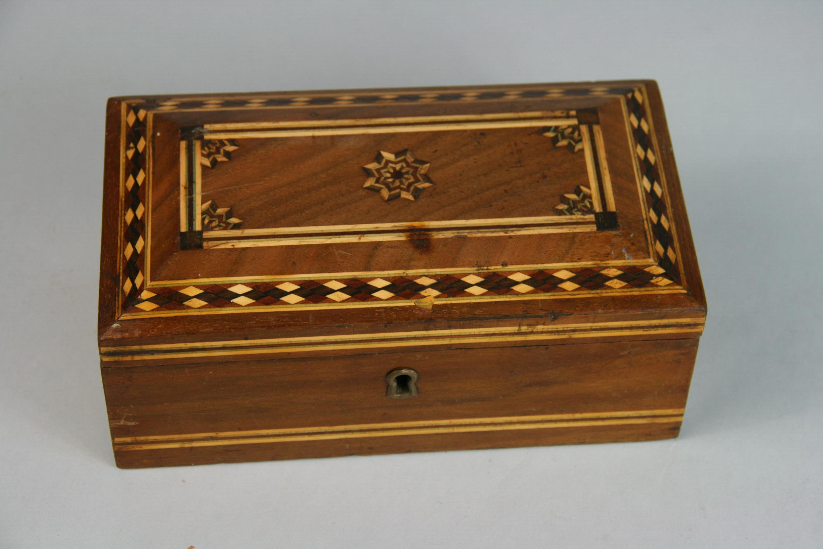 3-650 Domed top inlaid wood box with metal liner.