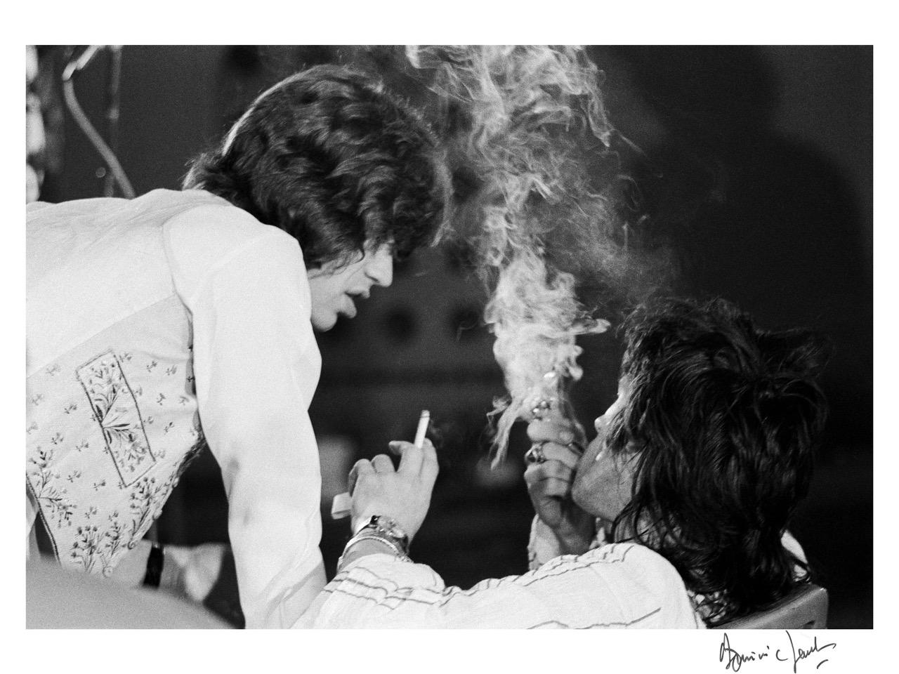 Dominic Lamblin Black and White Photograph - Getting   high !!!  Mick Jagger and Keith Richards 