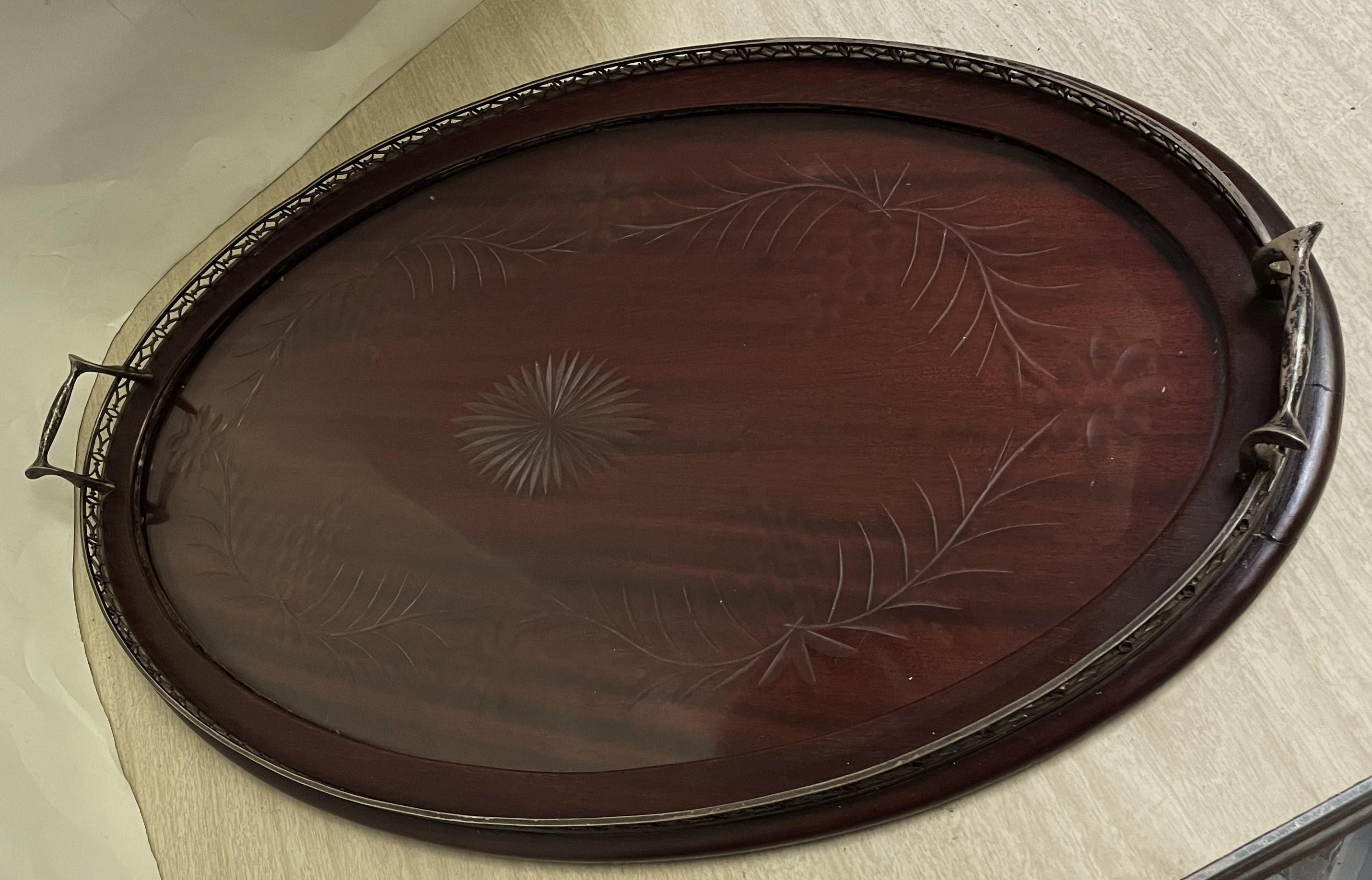 Here is a lovely and elegant oval tray with a sterling silver gallery which is signed with the Dominick & Haff symbol, sterling, 1454 (the identifying number) and 24 inches which is the width of the gallery (the tray , including the handles is about