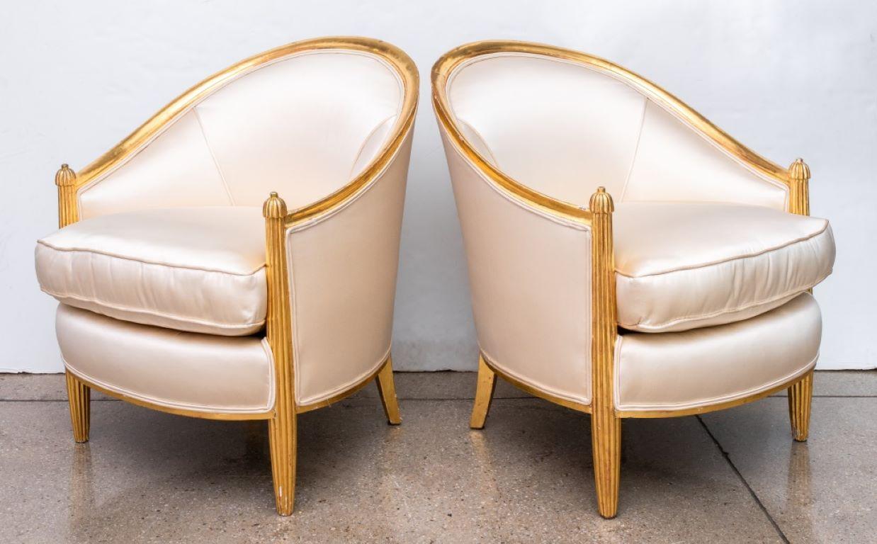 Pair of 31Dominique attributed Art Deco gilt wood armchairs with swoop backs and cream satin upholstery, in the manner of Emile-Jacques Ruhlmann (French, 1879-1933).

Dealer: S138XX