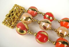 Bracciale Dominique Aurientis arancione dipinto a mano a 3 fili con perline anni '80