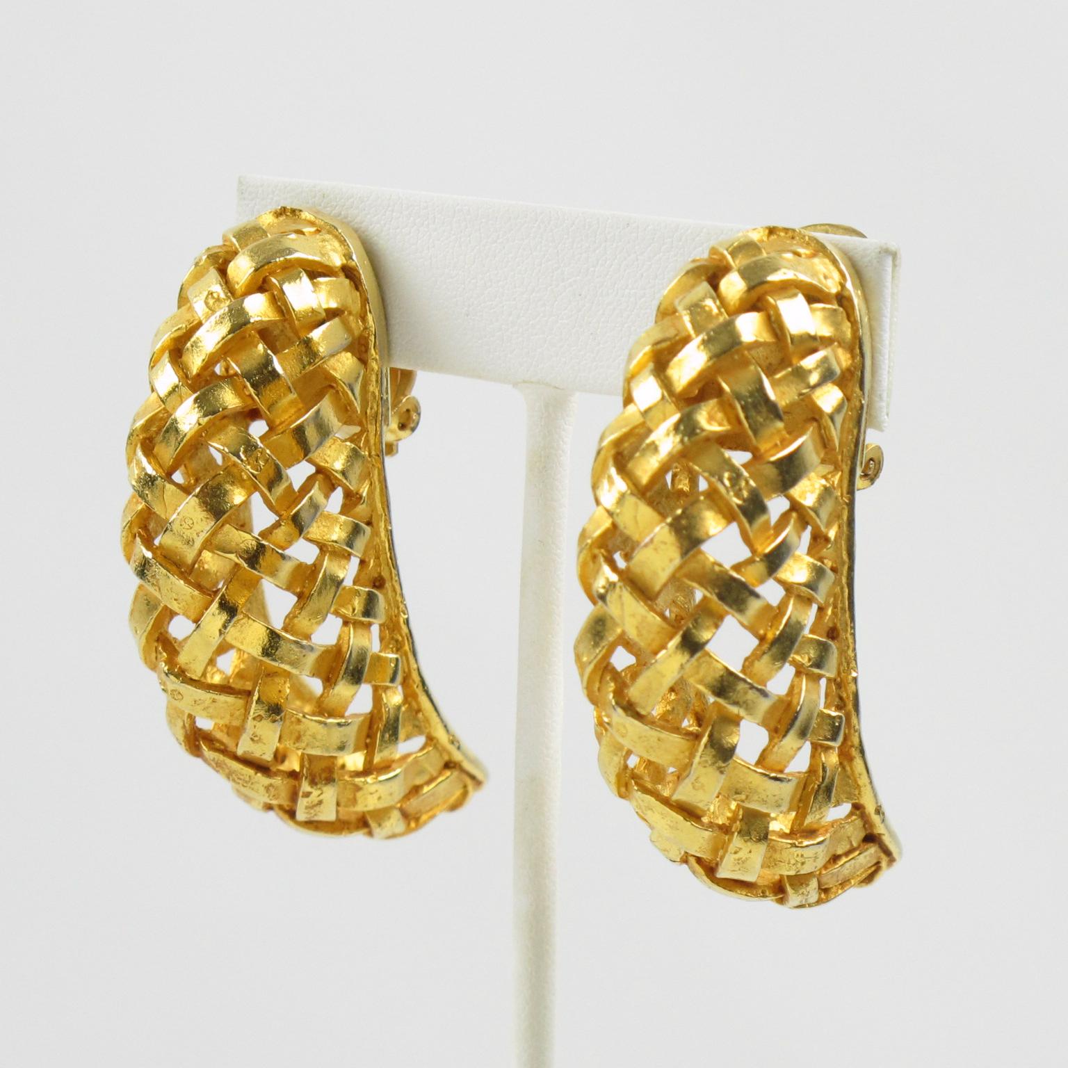 Lovely Dominique Aurientis Paris signed clip-on earrings. Features an oversized crescent shape with braided gilt metal all carved and see-thru. Signed underside with the Aurientis brand logo. The braided pattern is a favorite of the designer and has