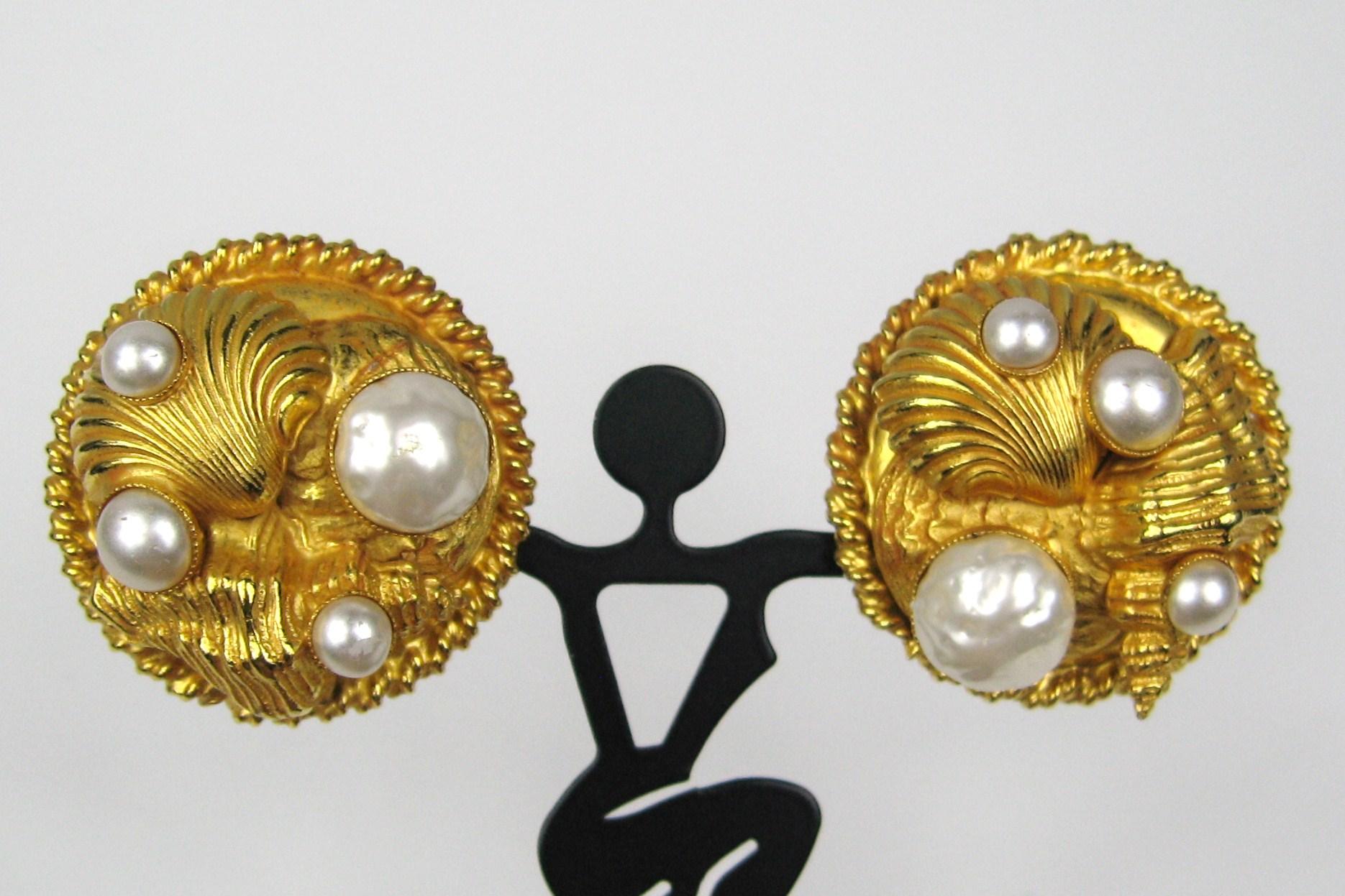 Created by famed Parisian designer Dominique Aurientis Gold Gilt Sea Shell Earring with pearls insets, what a dynamic design Measuring 1.5 in diameter 
This French jewelry designer has a vast international customer base and is known throughout the