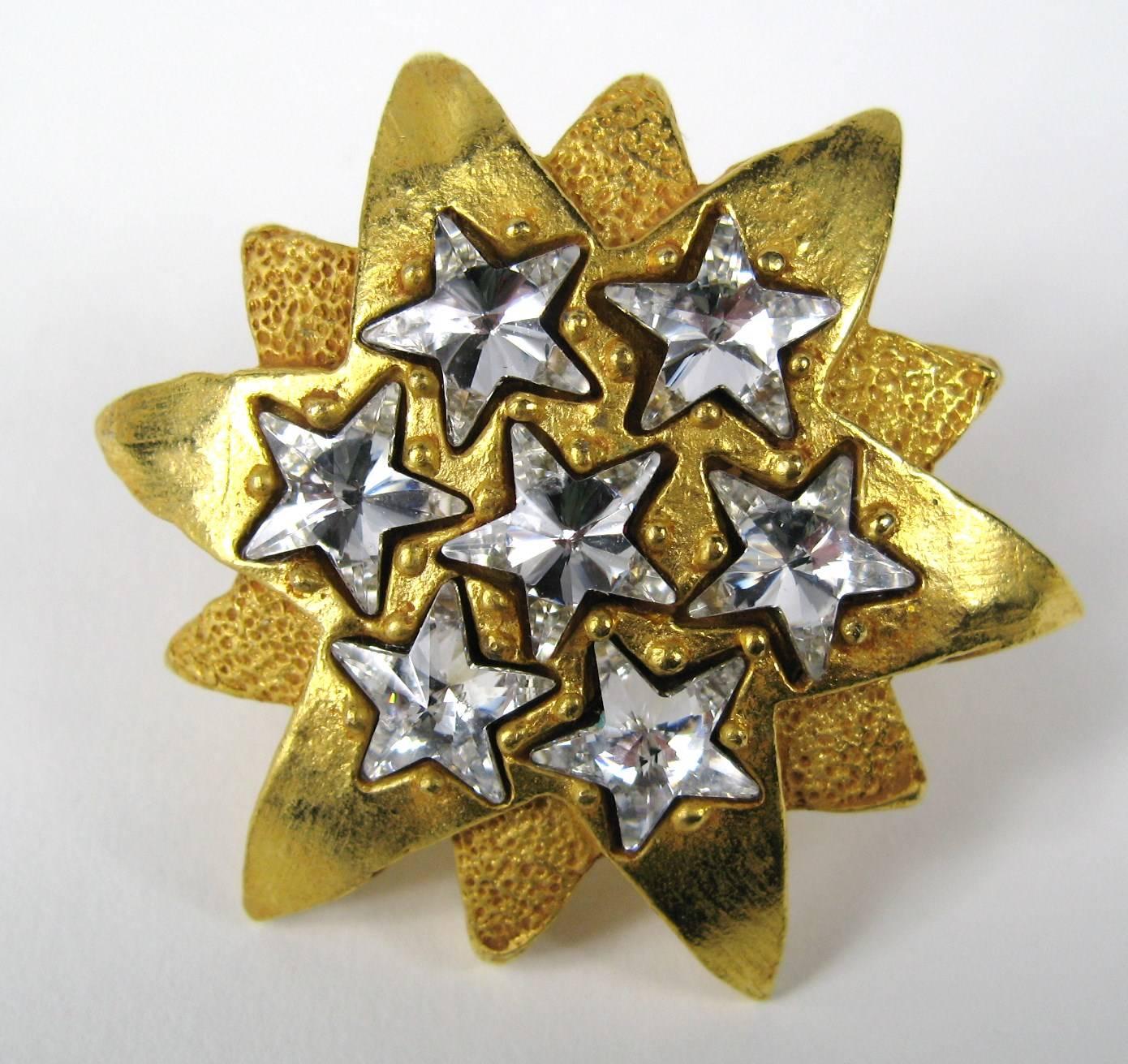 Dominique Aurientis Gold Gilt Crystal Star Clip on earrings, what a dynamic design. Circa 1980s Created by famed Parisian designer Aurientis. Measuring 1.9 in diameter.
This French jewelry designer has a vast international customer base and is known