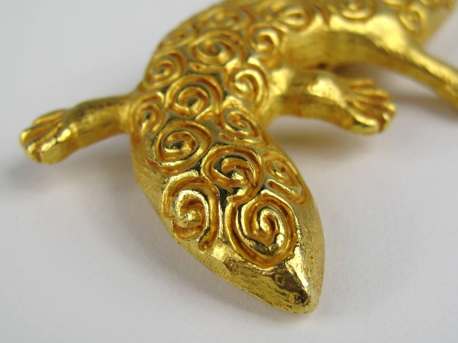 Dominique Aurientis Gold Gilt Lizard Brooch. It Measures 3.70 in x 1.50 in. This French jewelry designer has a vast international customer base and is known throughout the world for her artisan-crafted intricate designs that are rich important