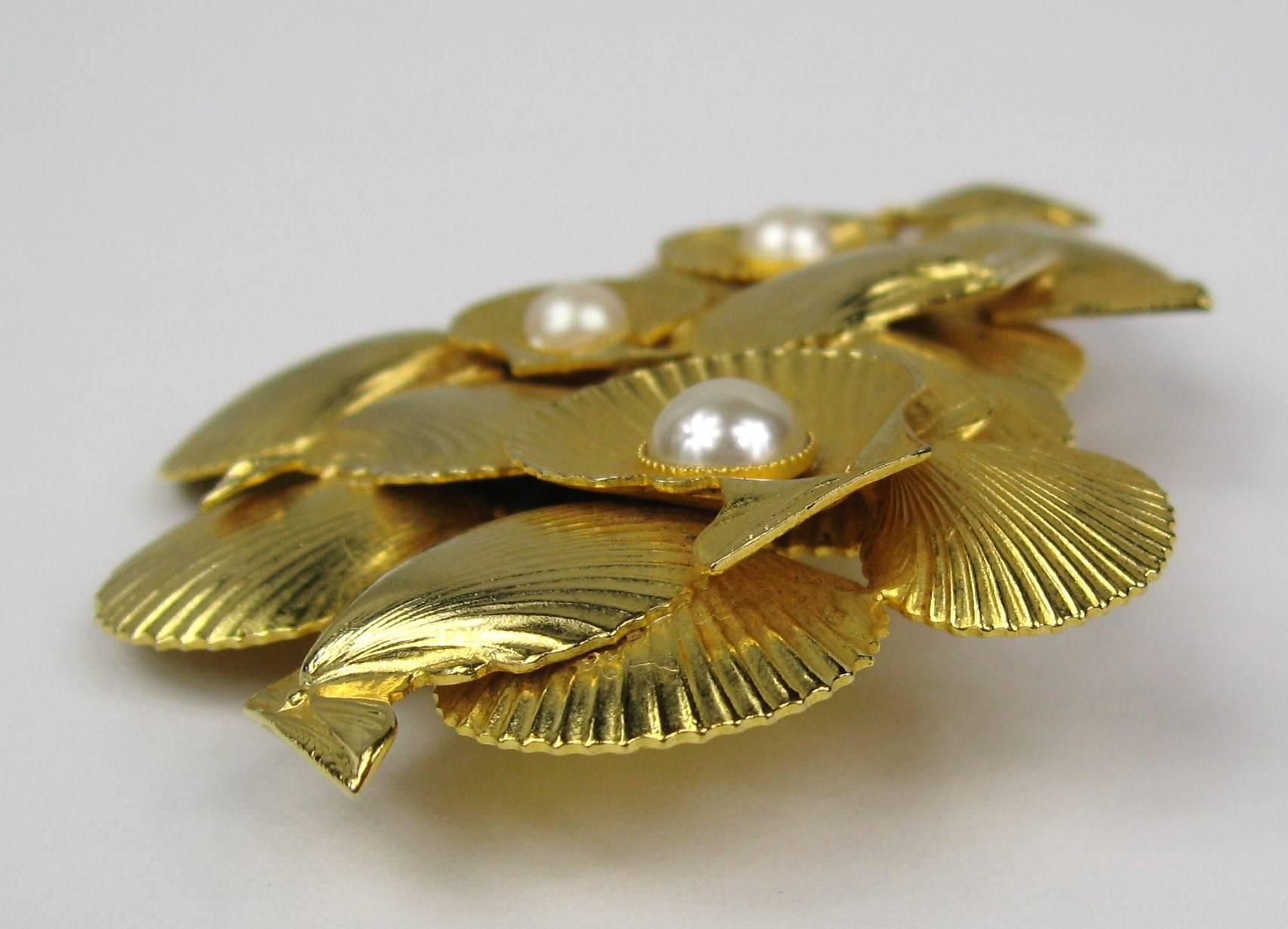 Dominique Aurientis Gold Gilt sea shell Brooch is a stunning example of this French Artisan work. Matching Necklace and earrings listed on our storefront as well. We have much more Aurientis listed on our storefront Measures 3.40 inches w x 2.35