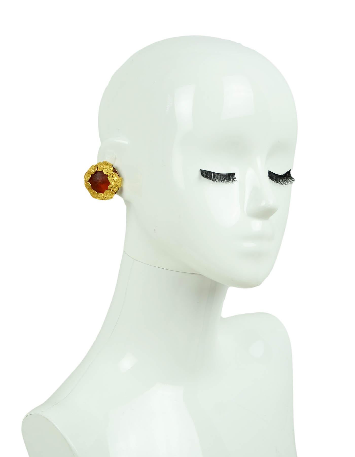 Dominique Aurientis Vintage Gripoix Glass Coin Clip On Earrings

Year of Production: 1980s
Color: Gold and orange
Materials: Metal and glass
Hallmarks: Dominique Aurientis Paris
Closure/Opening: Clip on 
Overall Condition: Excellent

Measurements: 