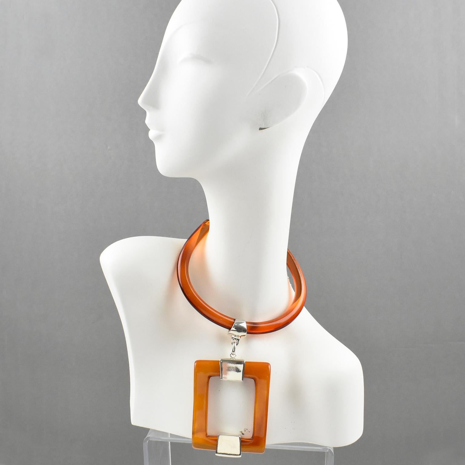 Amazing Dominique Denaive Paris signed pendant necklace. Modernist statement design with resin and silvered metal featuring a rigid neck band ornate with a huge geometric pendant. Lovely transparent orange and orange amber marble colors. Lobster