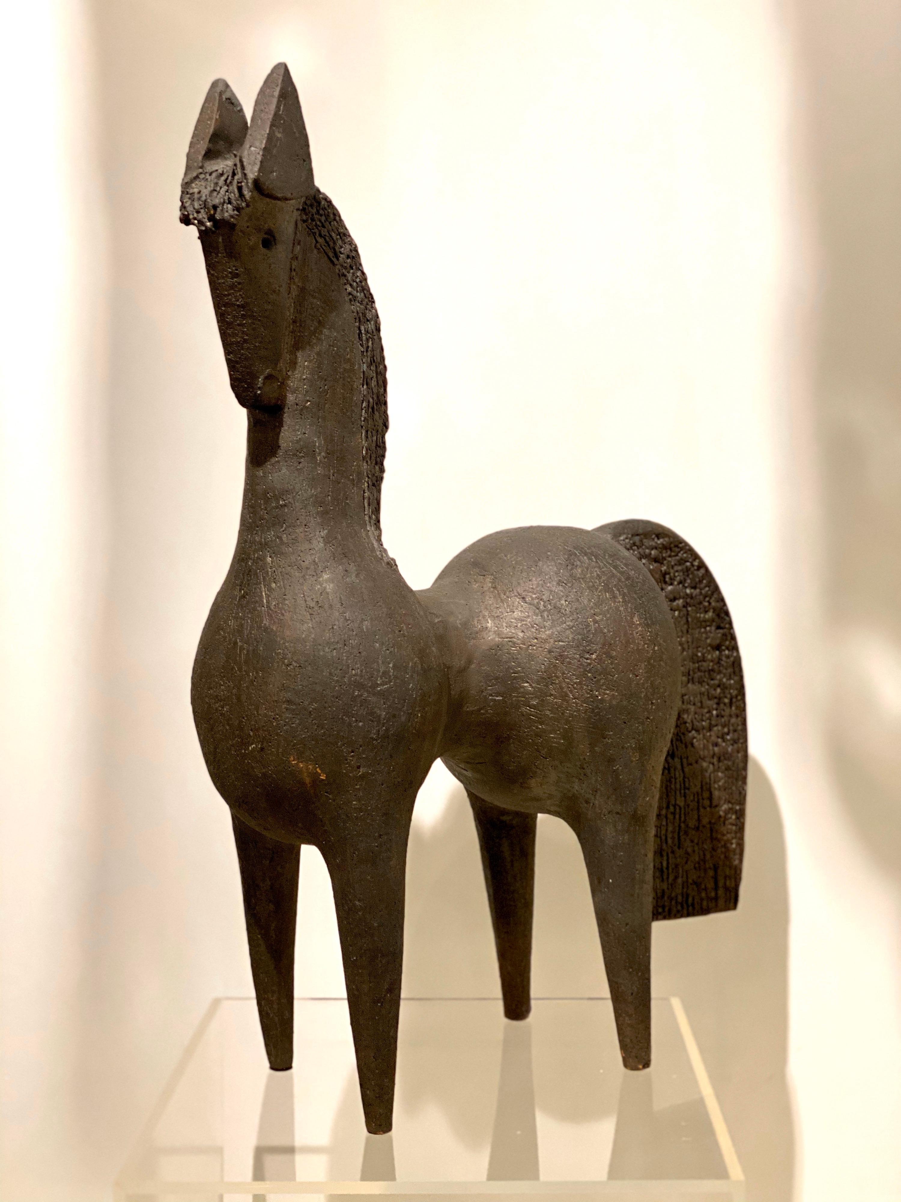 Born in 1956, D.Pouchain is a French potter using different ceramic techniques to create in a single shot his stylized animals.
Clearly influenced by primitive Art, his pieces are coated with manganese and copper, which gives a unique dark bronze