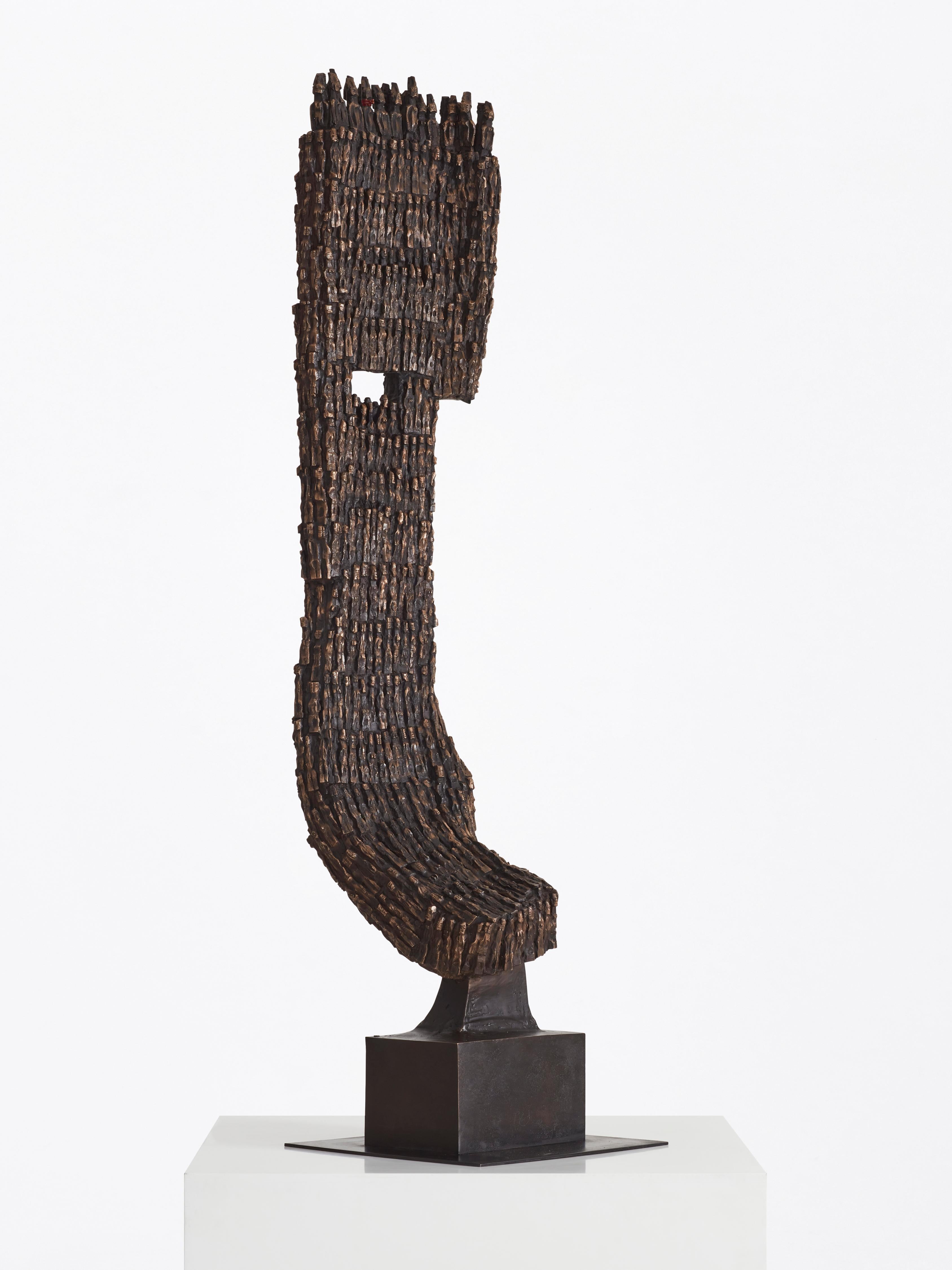 Steeped in the cultural practices of his native Benin, Dominique Zinkpè’s work is imbued with a guiding reverence for tradition and a keen sensitivity to contemporary concerns. The towering bronze form was made using the ancient lost wax casting