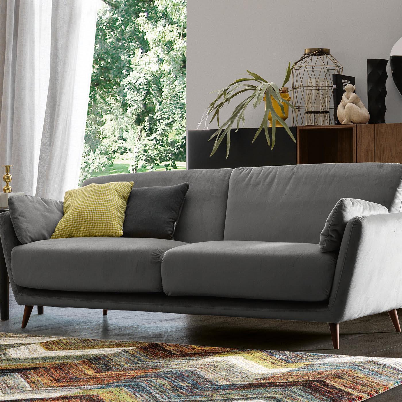 With hidden metal supports in its legs, the Domino 3-seater Sofa is surprisingly sturdy. Featuring flared midcentury modern-style legs, the sofa can be upholstered in the fabric of your choosing. Shown here with linen upholstery in Jeans and
