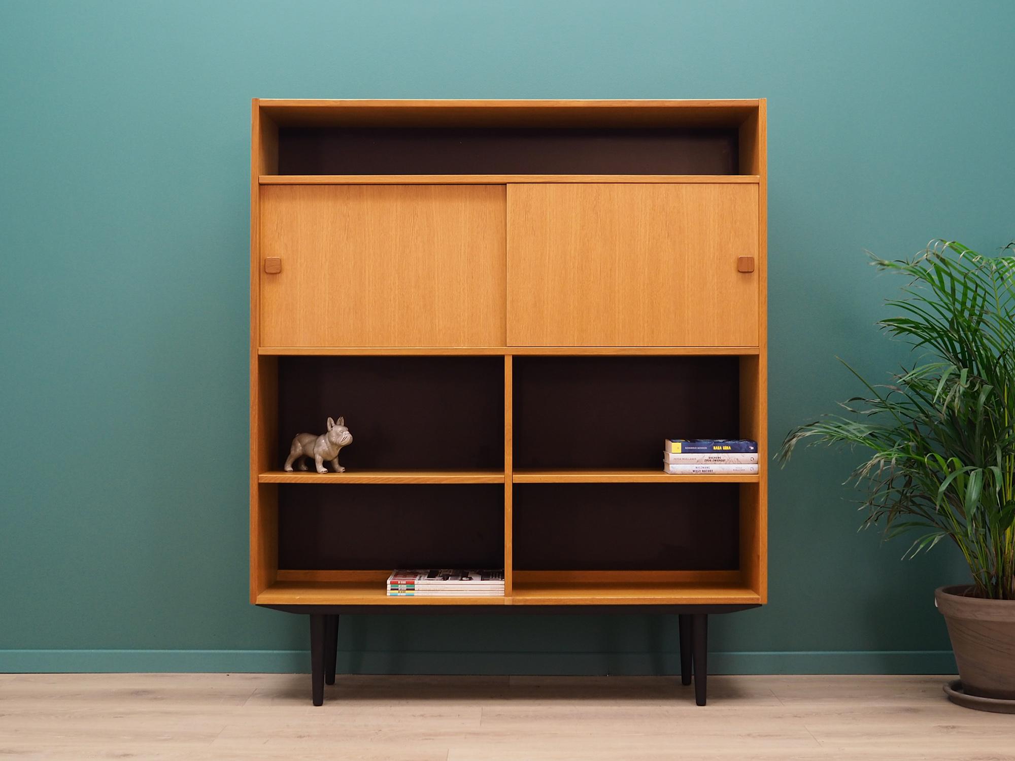Fantastic bookcase - library from the 1960s-1970s. Scandinavian design, Minimalist form. Manufactured by Domino Mobler. The furniture is finished with ash veneer. Shelves with adjustable height. Preserved in good condition (small bruises and