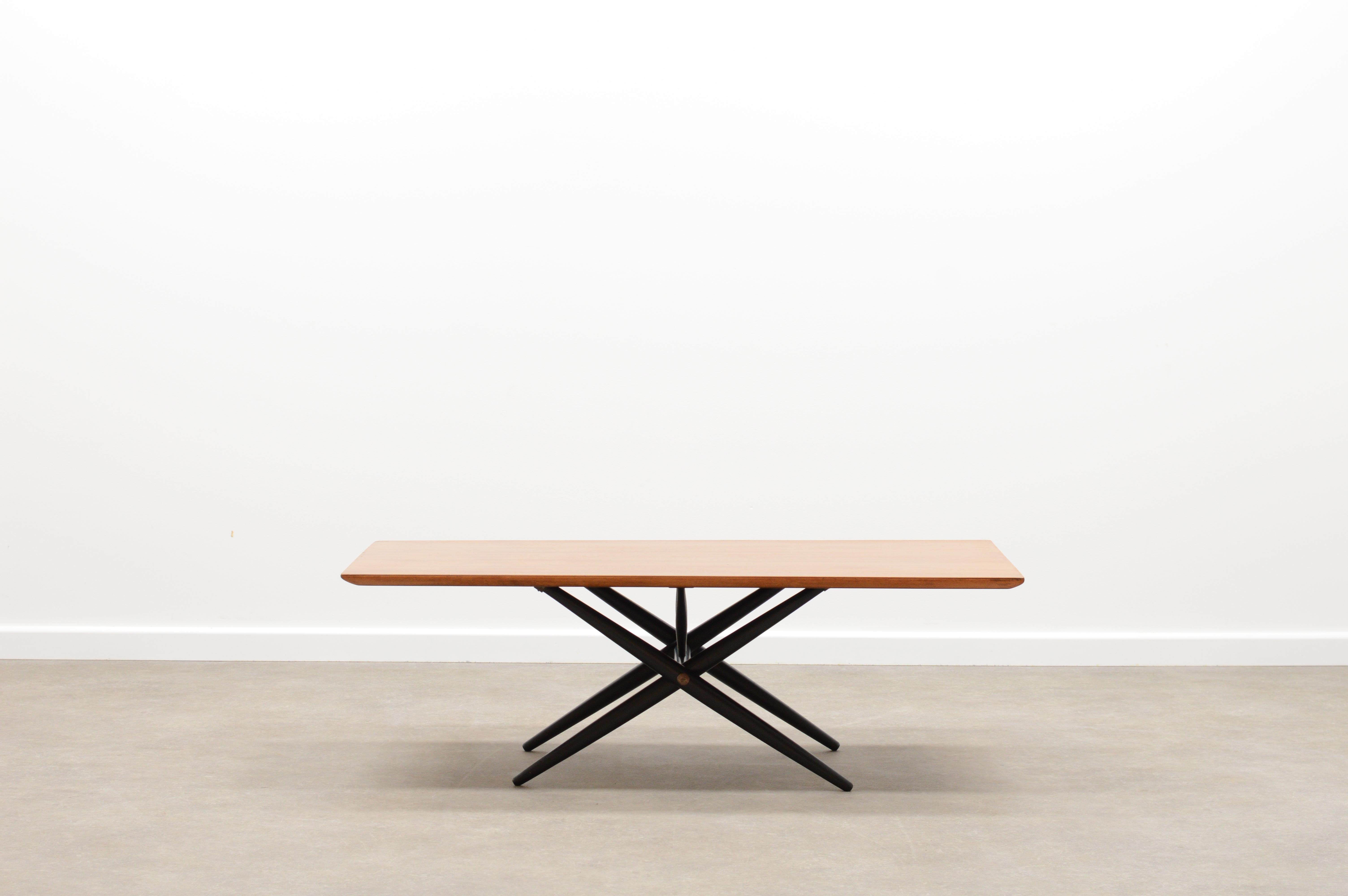 “Domino” coffee table by Ilmari Tapiovaara for Asko Finland. Designed in 1954. Black cross-legged base and teak rectangular top. One honist repair at a corner. In good vintage condition. 

 