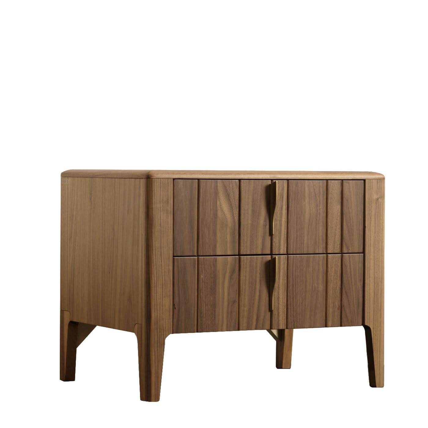 Featuring vertically striped slats of smooth Canaletto walnut, the Domino Nightstand is a celebration of natural wood. Featuring Modo10's Havana finish, the wood's veins shine through, becoming the defining feature of the whole piece. With two