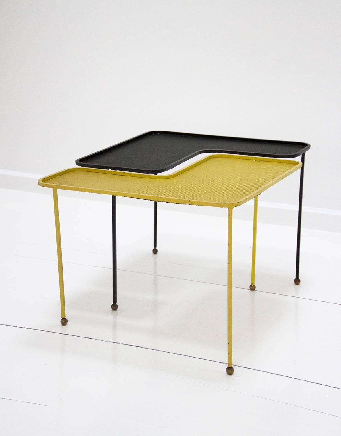 Pair of Domino coffee tables by Mathieu Matégot in brass, black and yellow lacquered perforated metal. In good condition, preserving the original patina.
Mathieu Matégot is a well-recognized designer from the 20th century. What makes him that