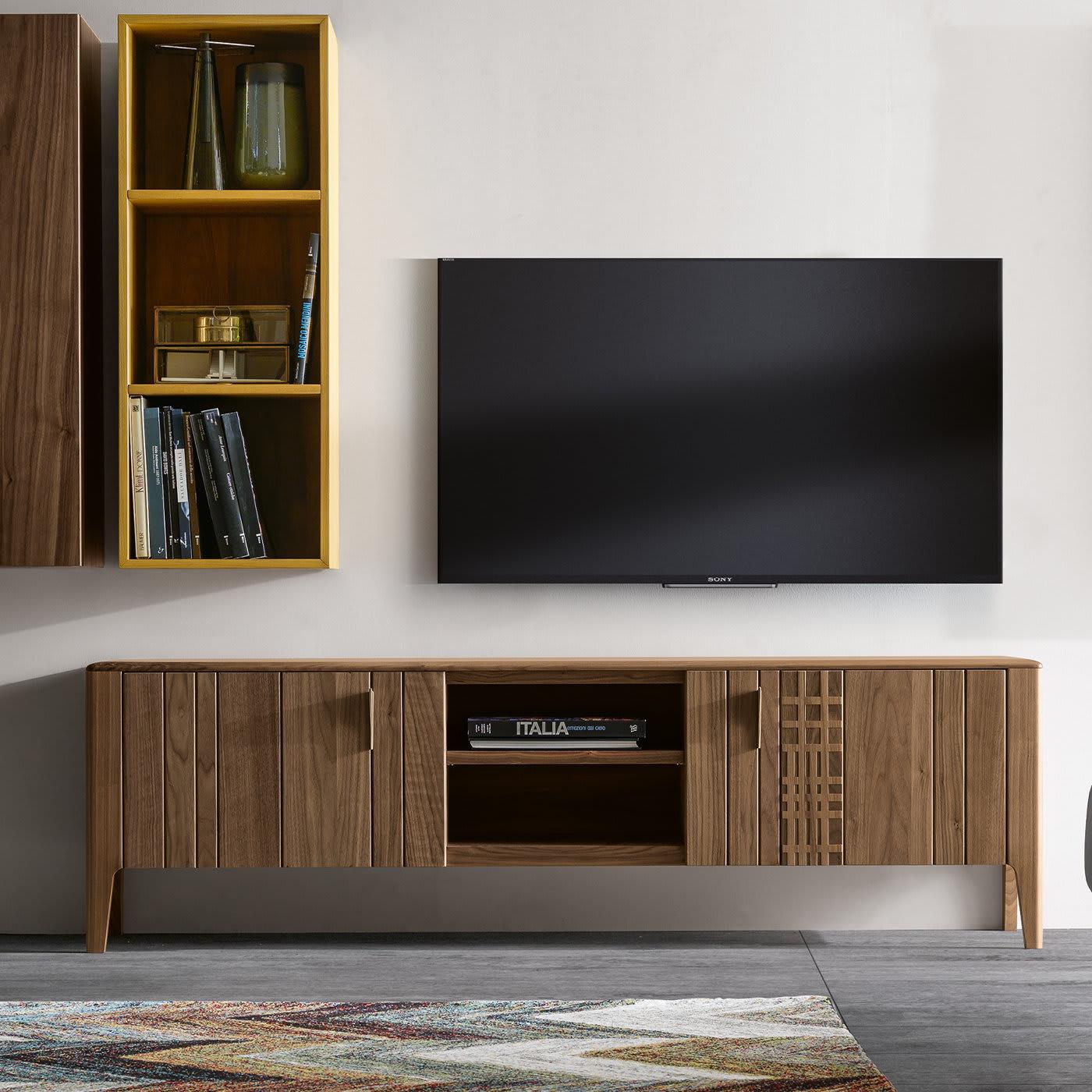 From a complete collection of living room furnishings in warm Canaletto walnut, the Domino TV Stand features vertical panels across its cabinets. Making the piece truly stand out is the sheer Havana stain, allowing the wood's natural veins and
